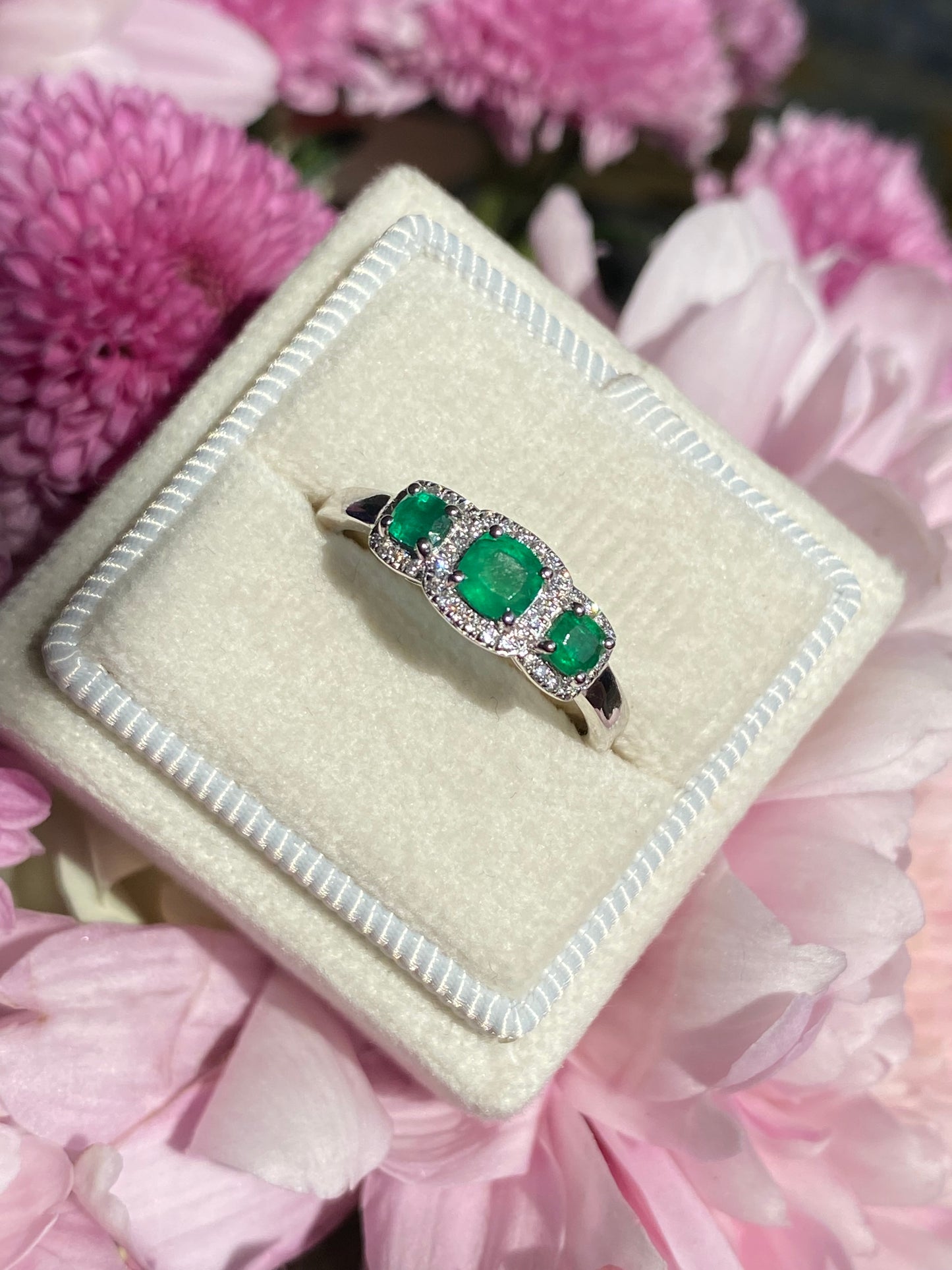 0.65ctw Emerald and Diamond Three Stone Halo Ring in Platinum