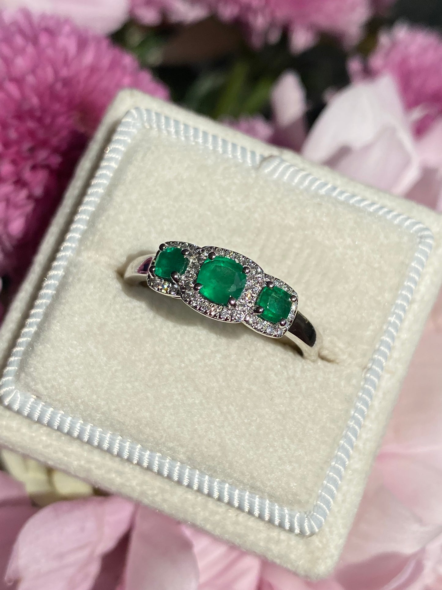 0.65ctw Emerald and Diamond Three Stone Halo Ring in Platinum