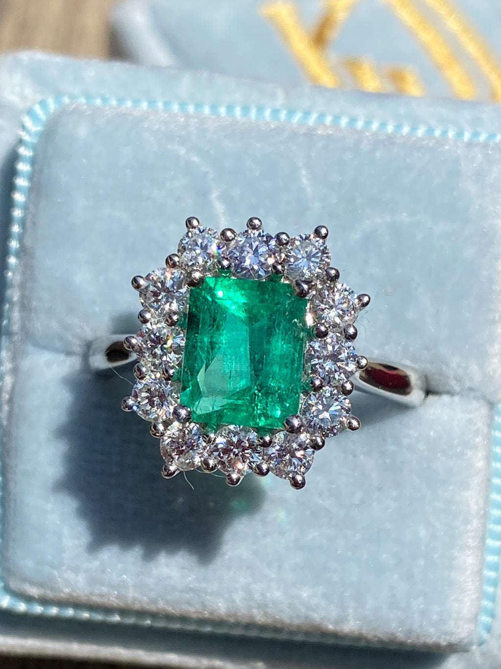 2.34 CTW Emerald Cut Colombian Emerald and Natural Diamond Halo Ring in Platinum