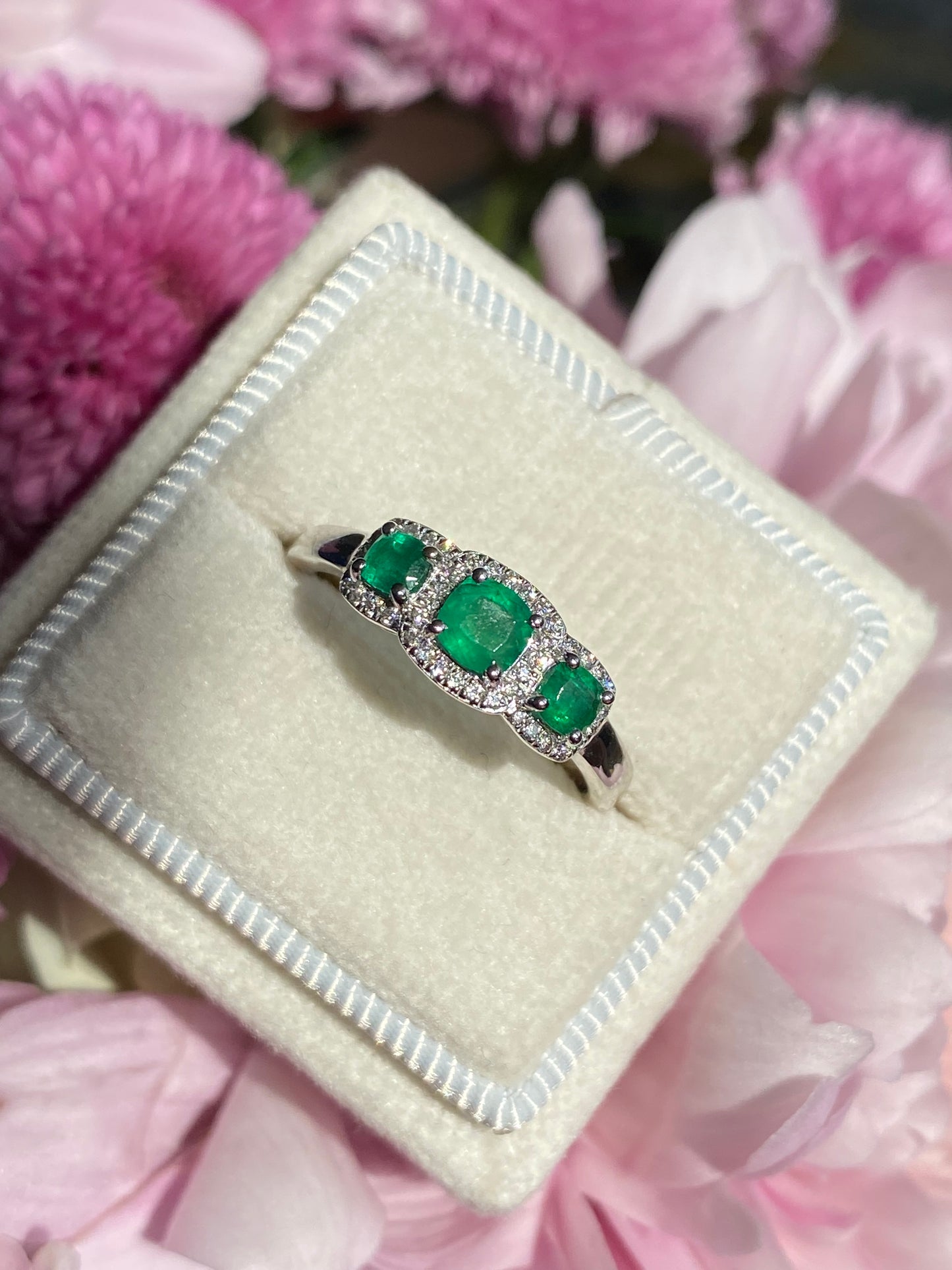 0.65ctw Emerald and Diamond Three Stone Halo Ring in Platinum