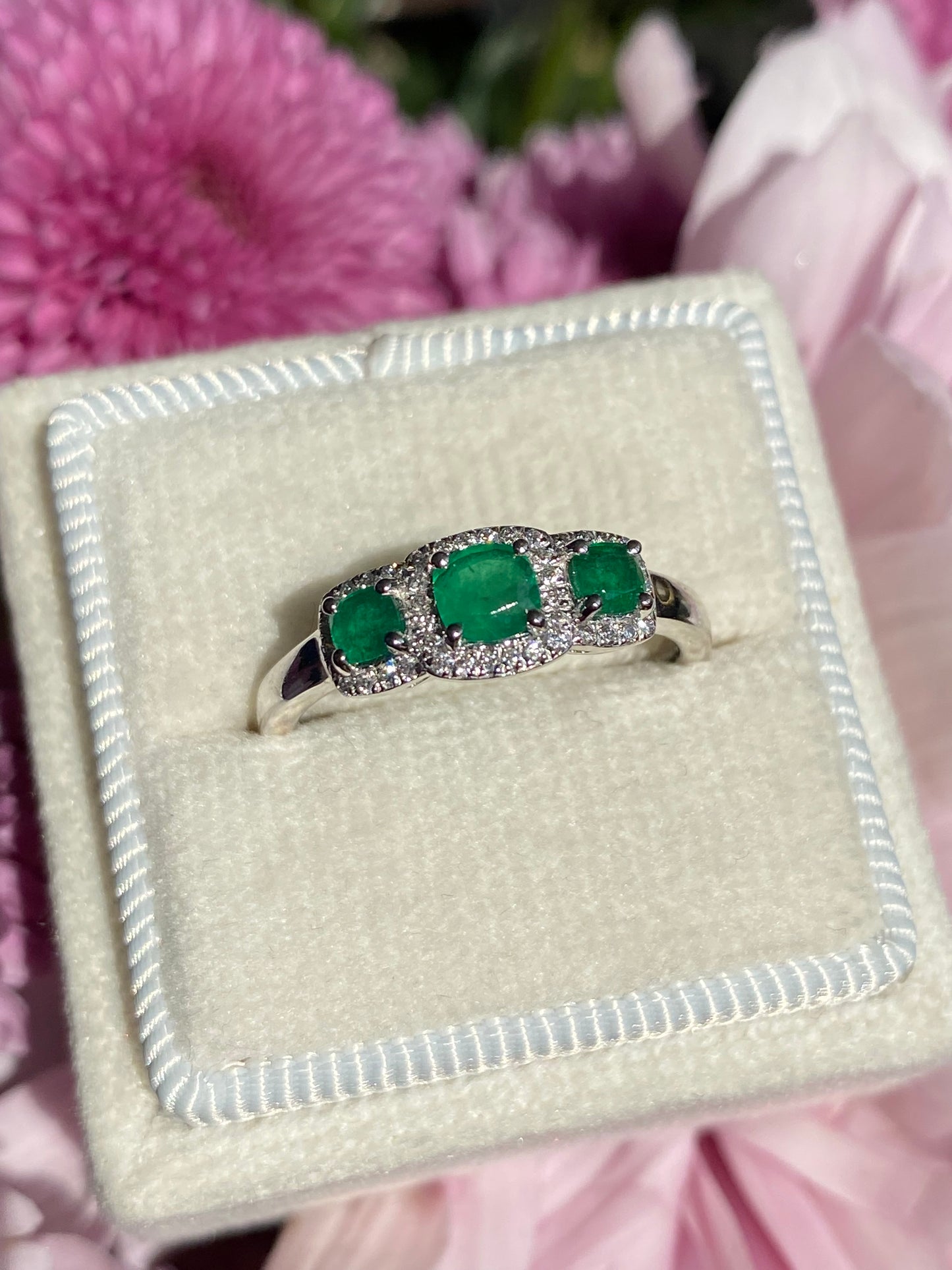 0.65ctw Emerald and Diamond Three Stone Halo Ring in Platinum