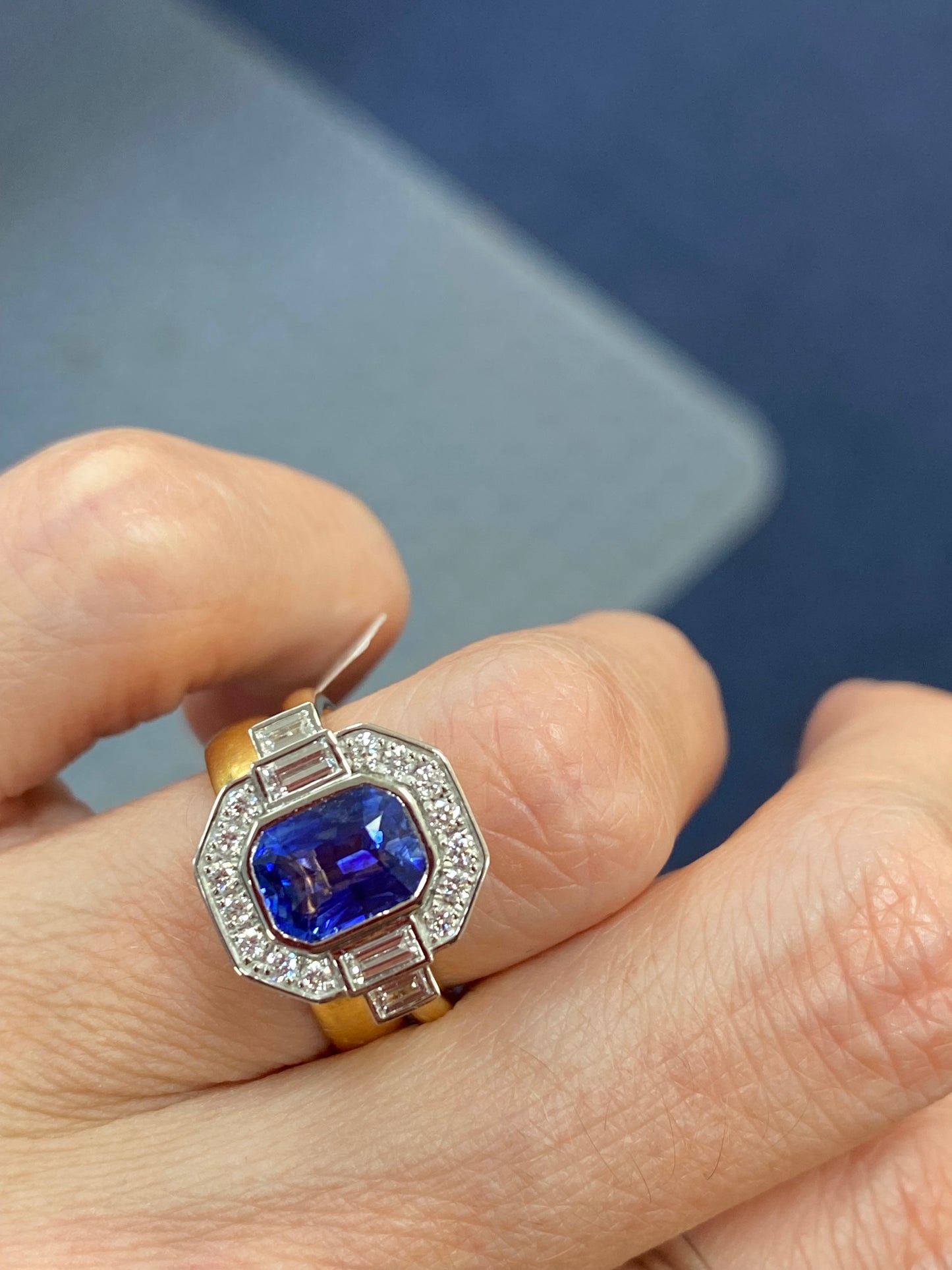 2.06 Carat Emerald Cut Sapphire and Natural Diamond Halo Ring in Platinum and 18ct Yellow Gold