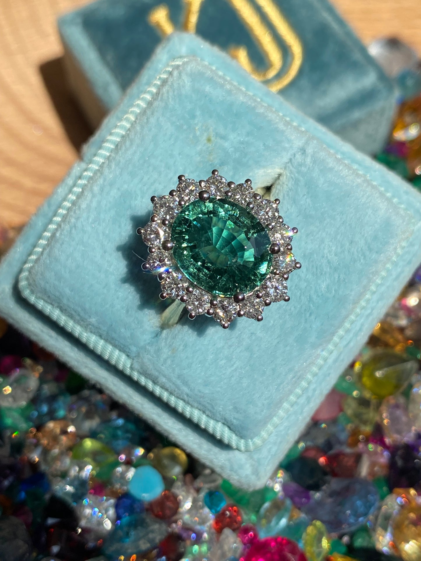 3.06 Carat Blue Tourmaline and Natural Diamond Halo Ring in Platinum and 18ct Yellow Gold