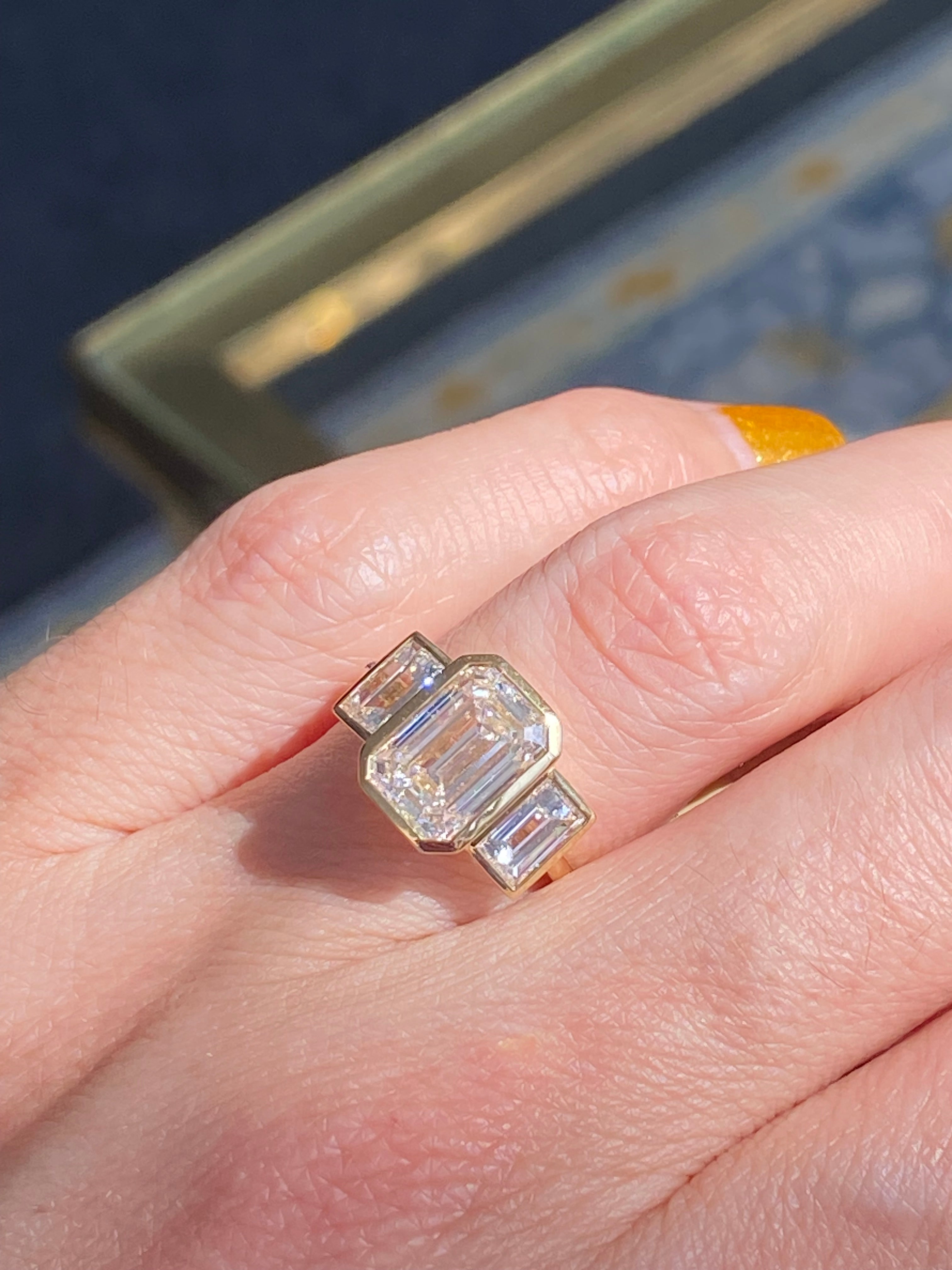 4.32 CTW Emerald Cut Bezel Set Lab Diamond Ring in 18ct Yellow Gold