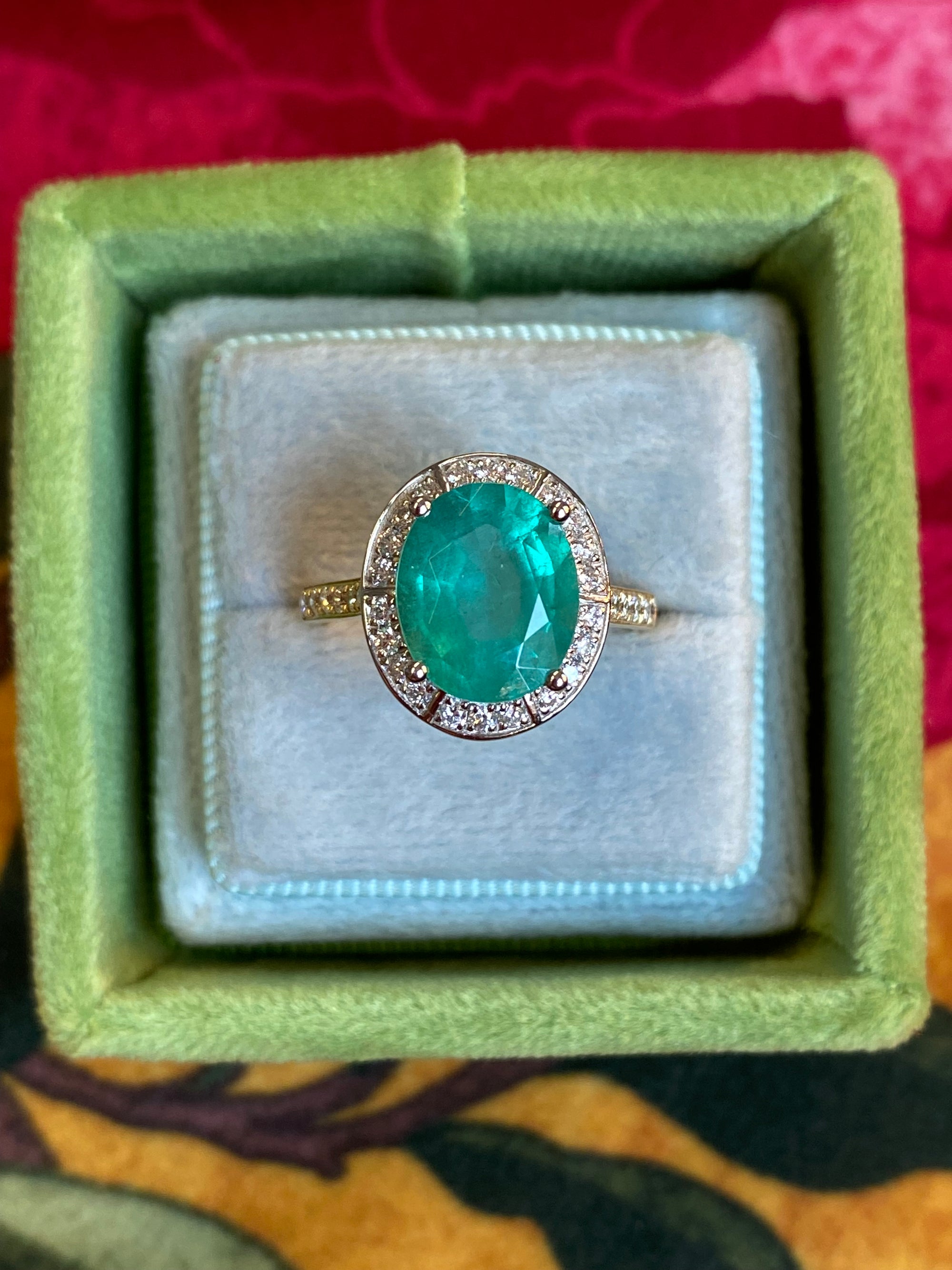 3.21 CTW Oval Cut Emerald and Natural Diamond Halo Engagement Ring in Platinum and 18ct Yellow Gold