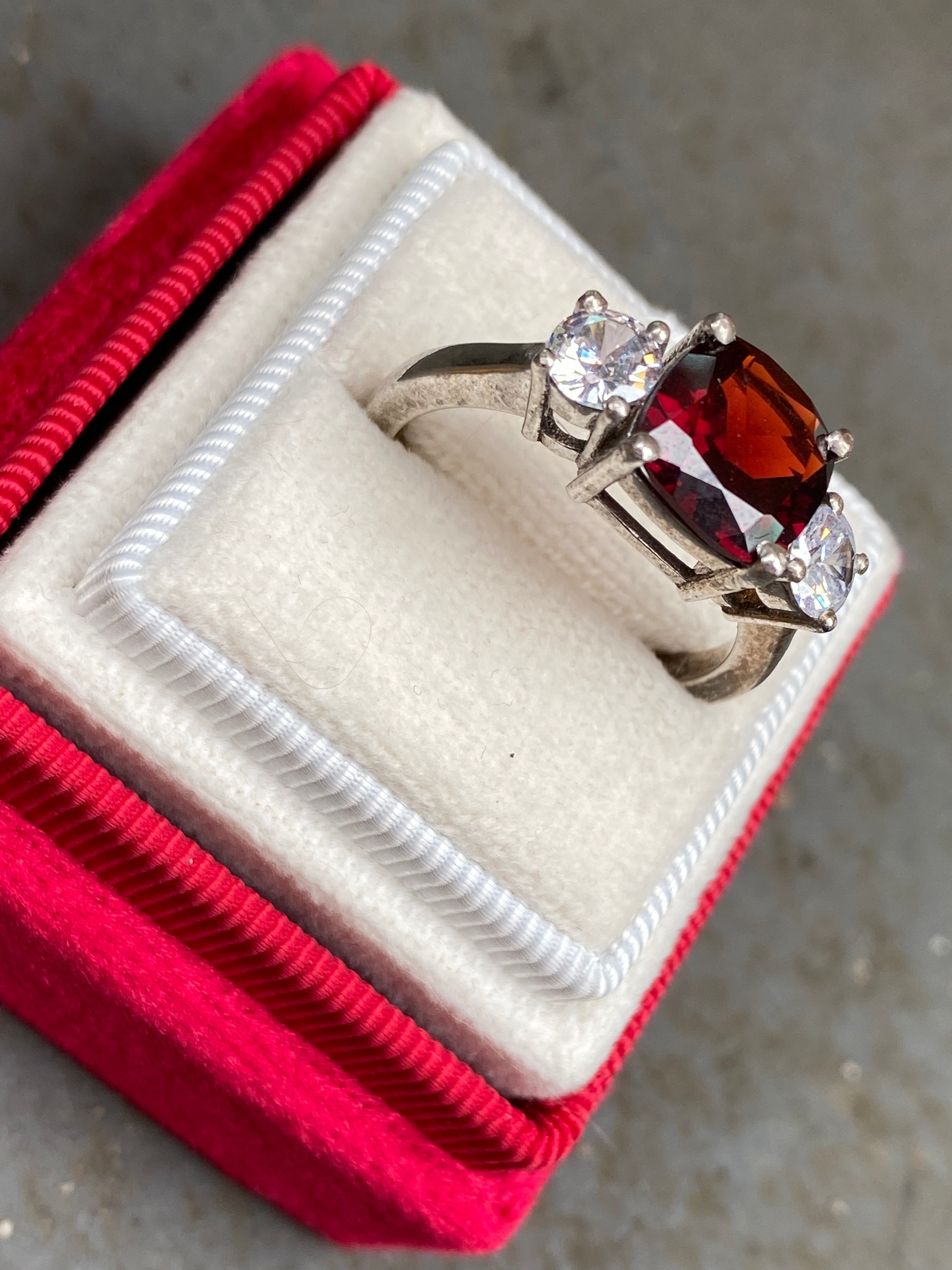 4.00 CTW Cushion Cut Garnet and Moissanite Three Stone Ring in Sterling Silver
