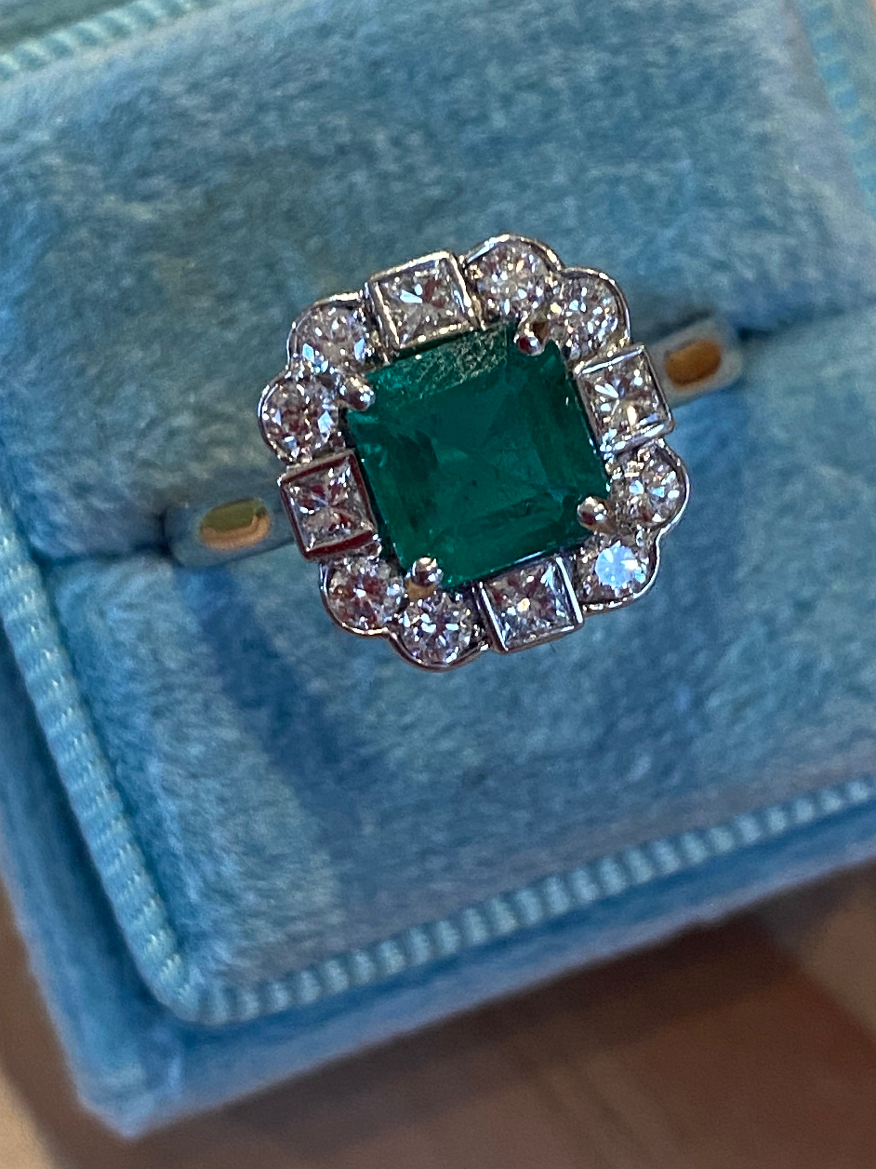 1.35 Carat Emerald Cut Emerald and 0.49 CTW Natural Diamond Halo Ring in Platinum