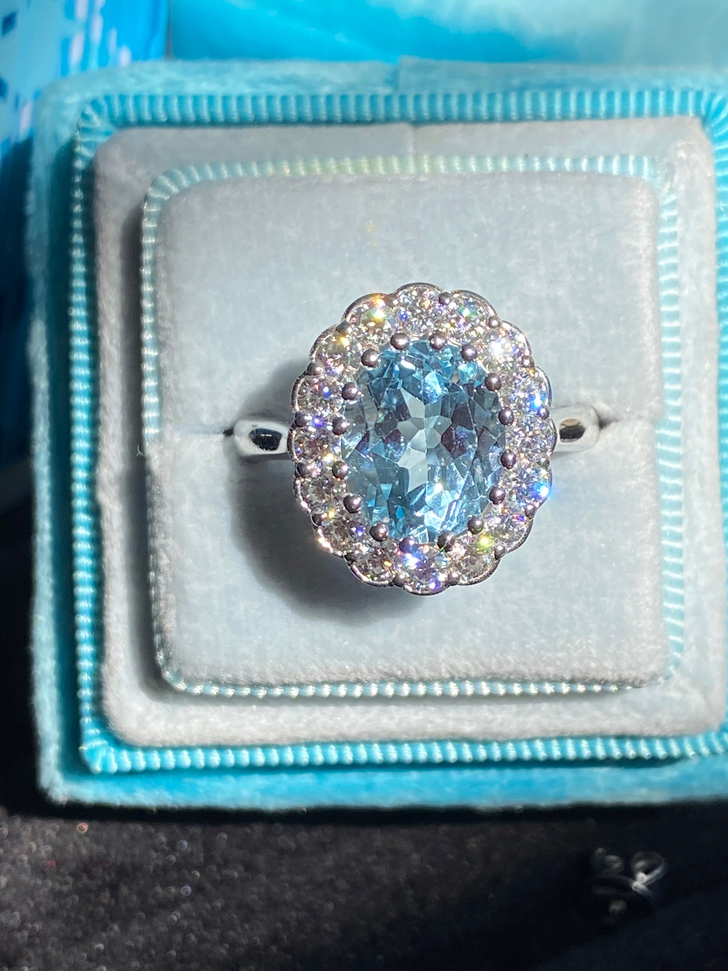 5.50 CTW Oval Cut Blue Topaz and Moissanite Halo Cocktail Ring