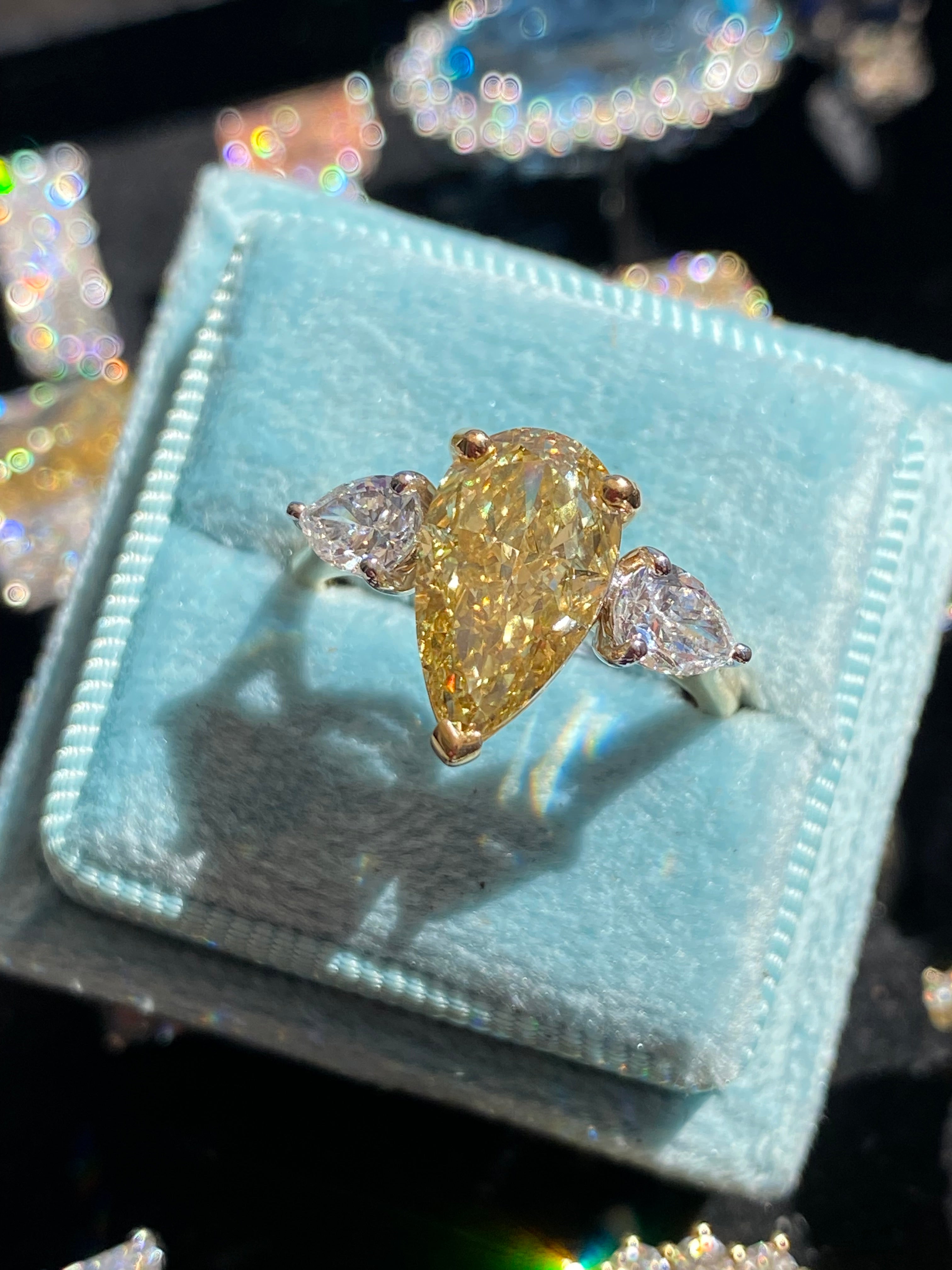 4.04 CTW Pear Cut Fancy Yellow Lab Diamond Three Stone Engagement Ring in 18ct Yellow and White Gold