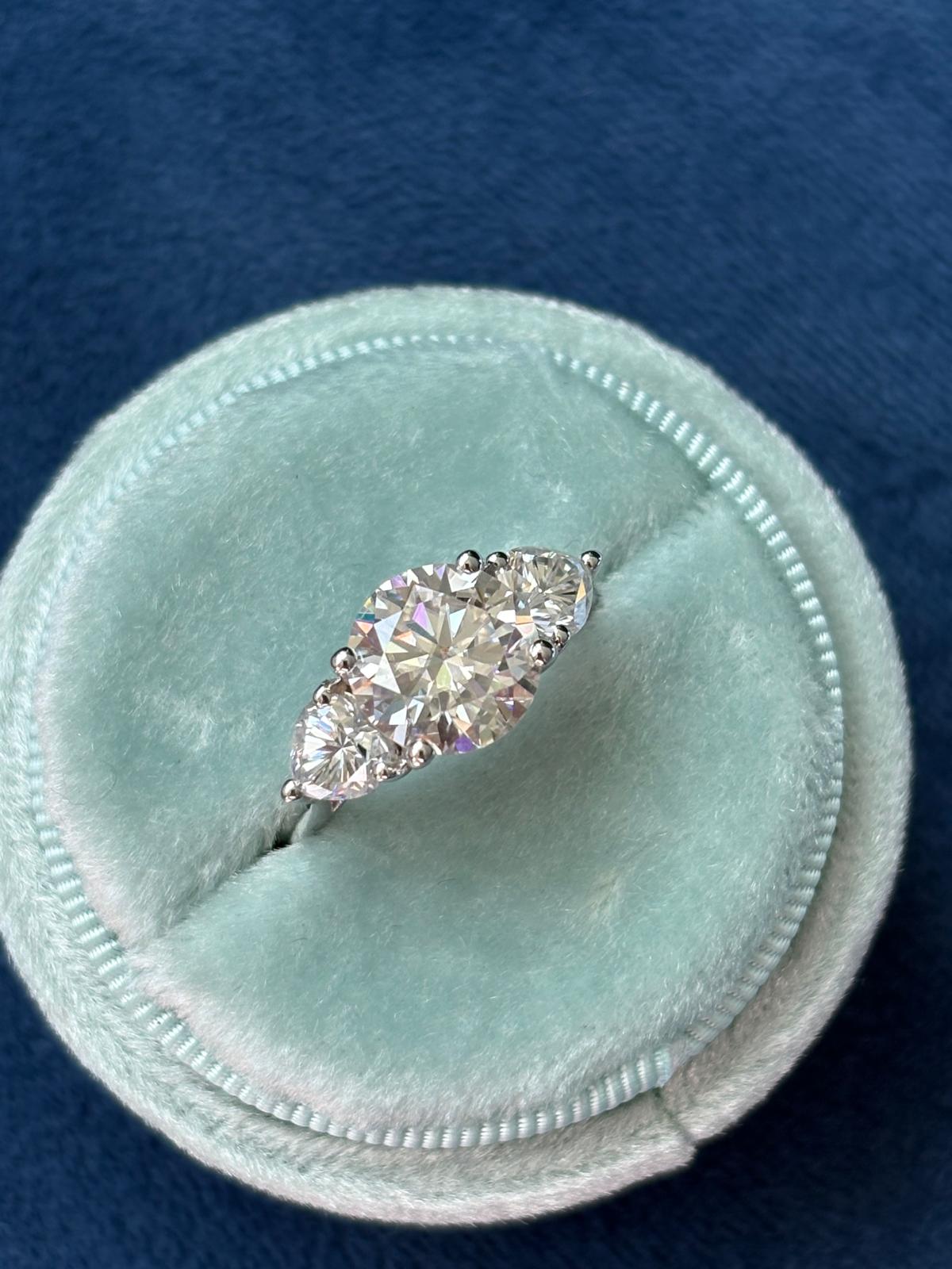 3.40 CTW Round and Heart Shape Moissanite Three Stone Ring in Sterling Silver