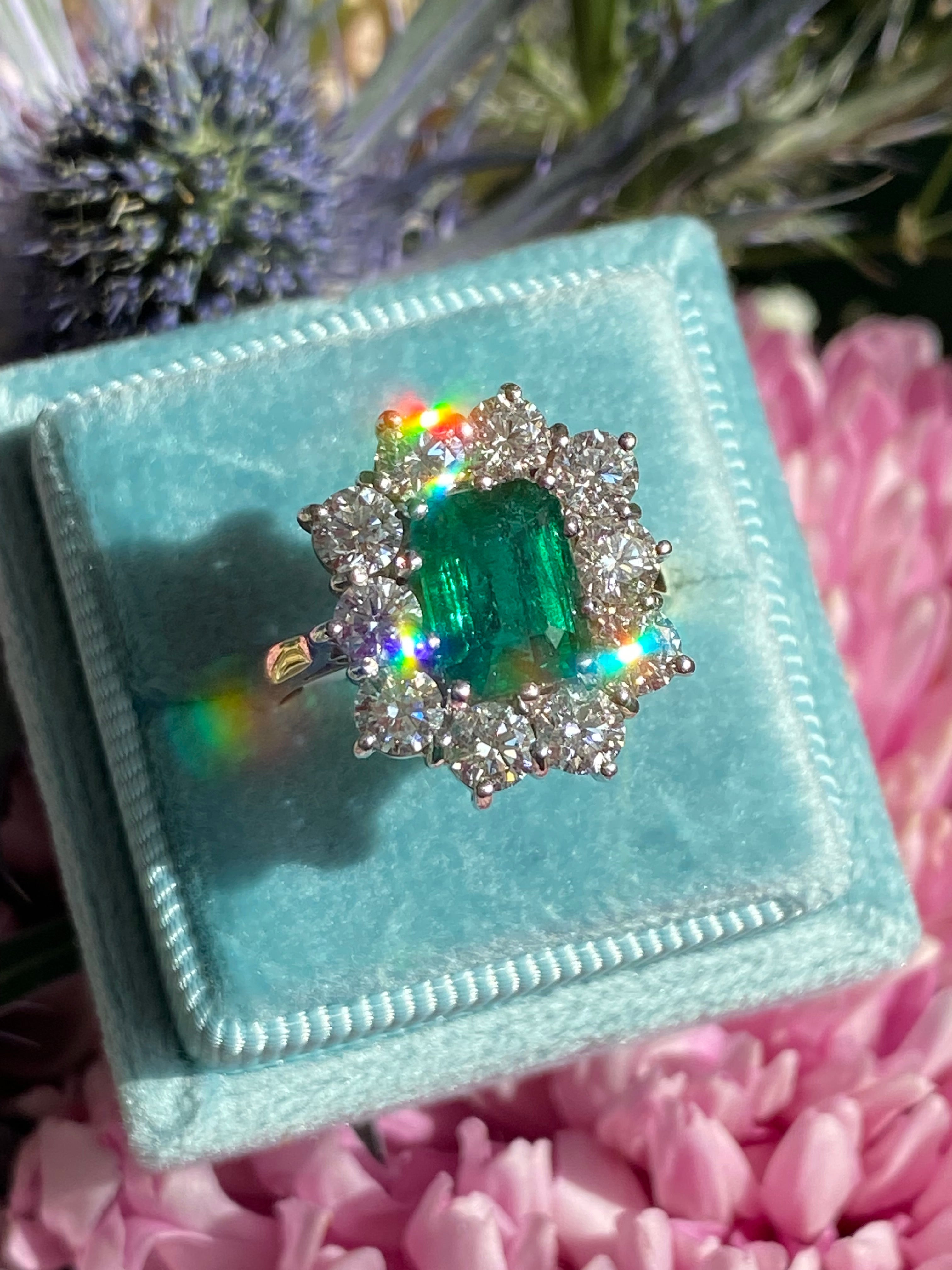 Outrageously Fantastic 4.17 CTW Emerald and Diamond Halo Ring in 18ct White and Yellow Gold