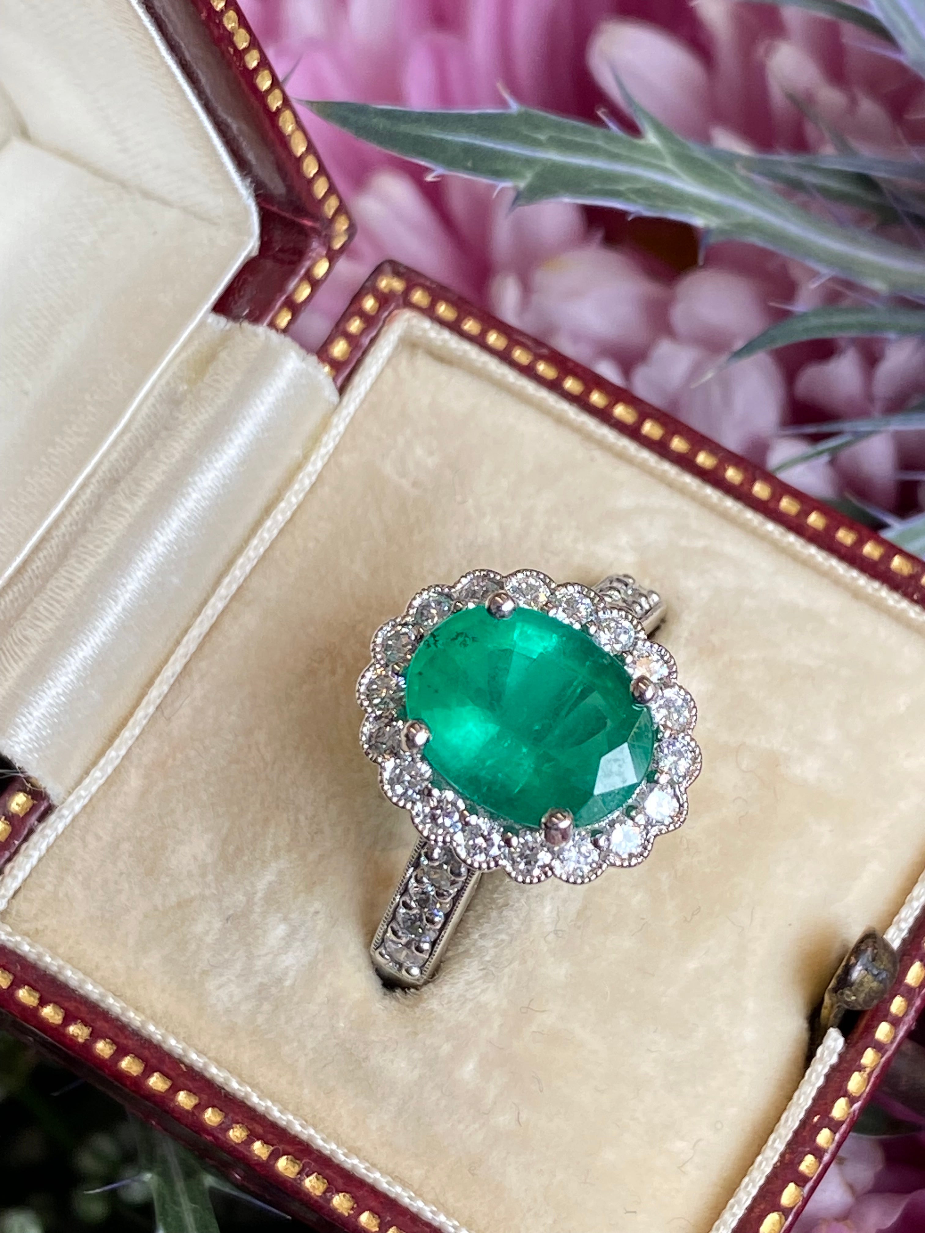 3.12 CTW Oval Cut Emerald and Natural Diamond Halo Ring in Platinum
