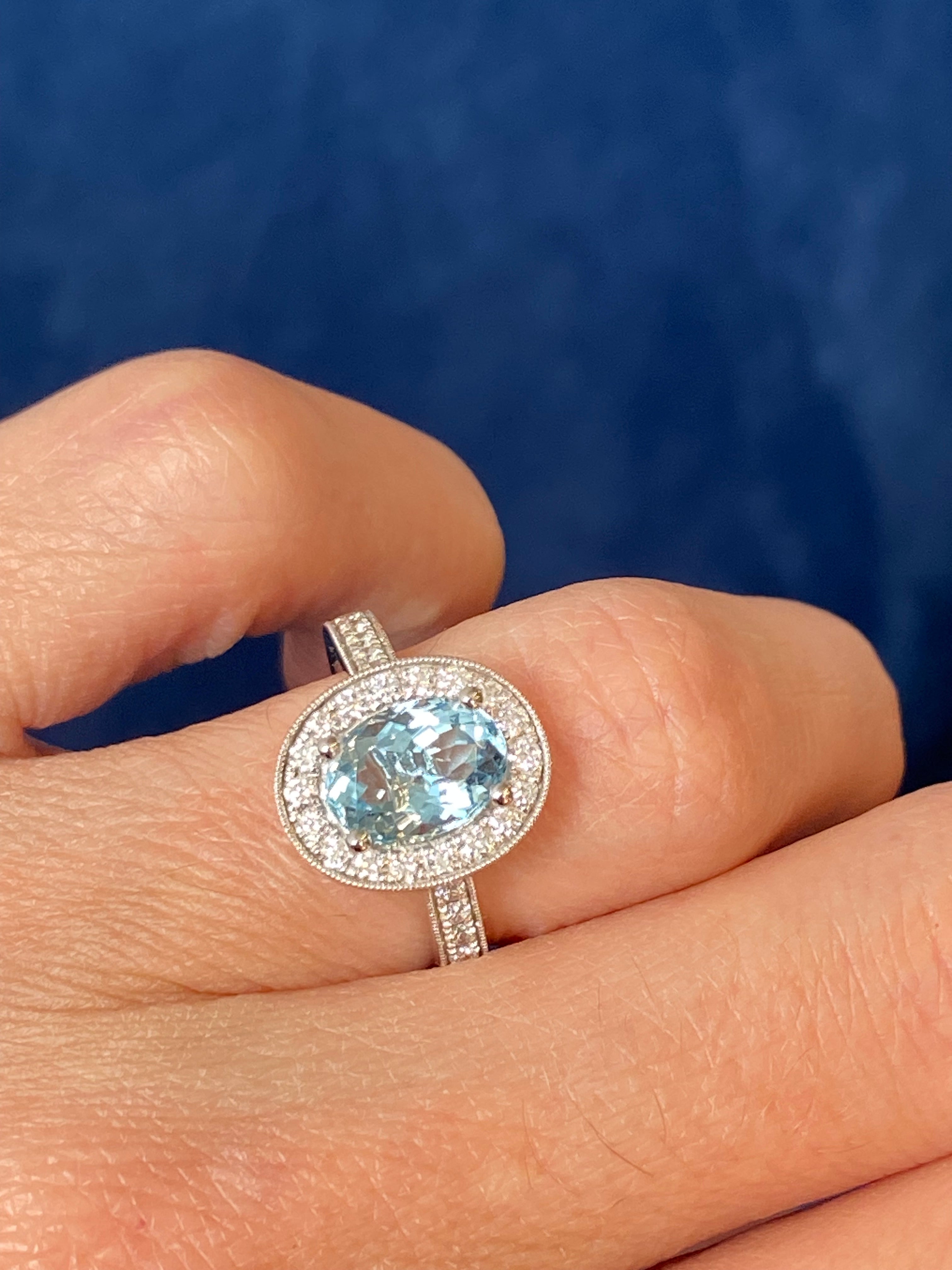 2.33 CTW Oval Cut Aquamarine and Natural Diamond Halo Engagement Ring in 18ct White Gold