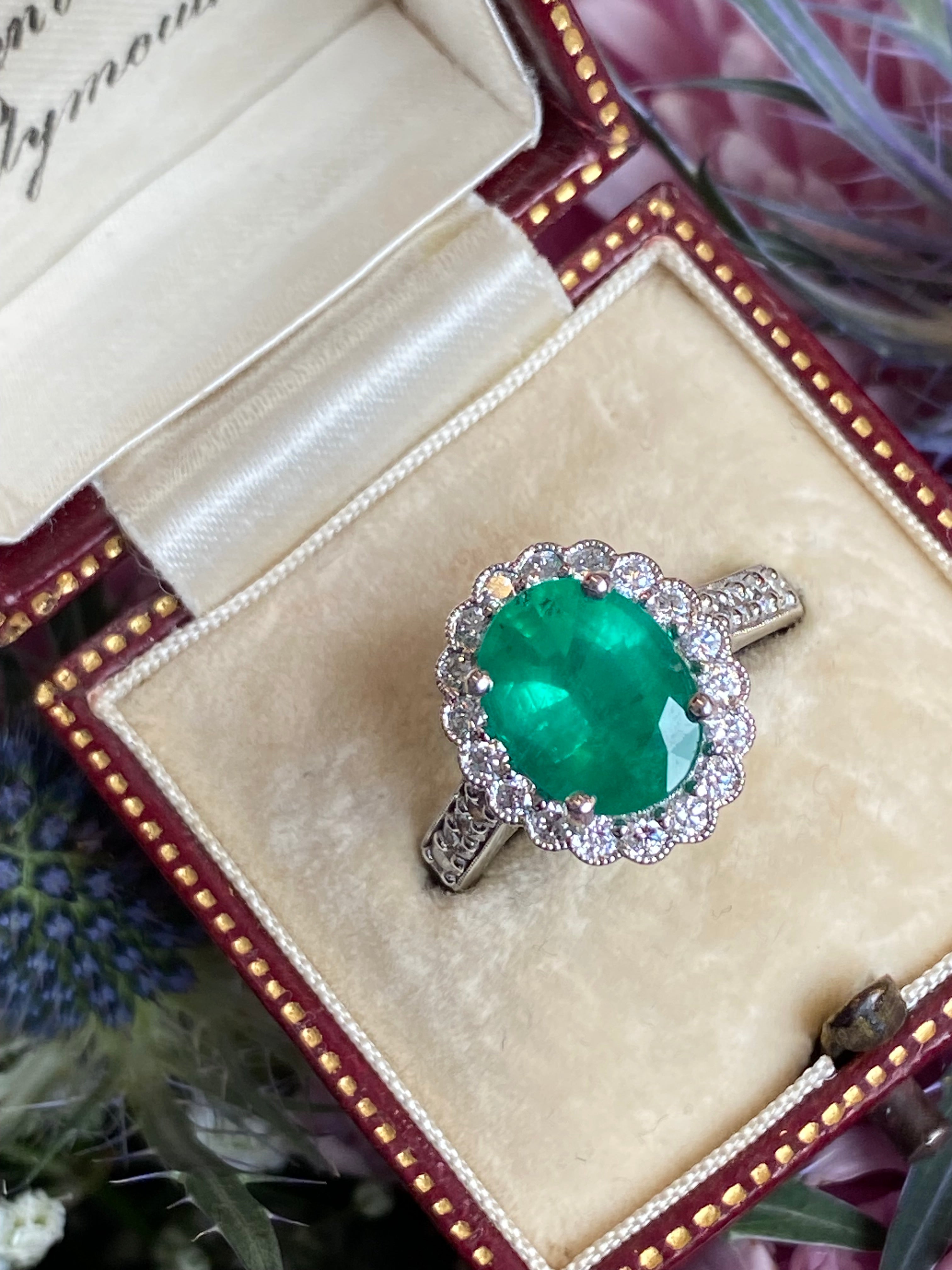 3.12 CTW Oval Cut Emerald and Natural Diamond Halo Ring in Platinum