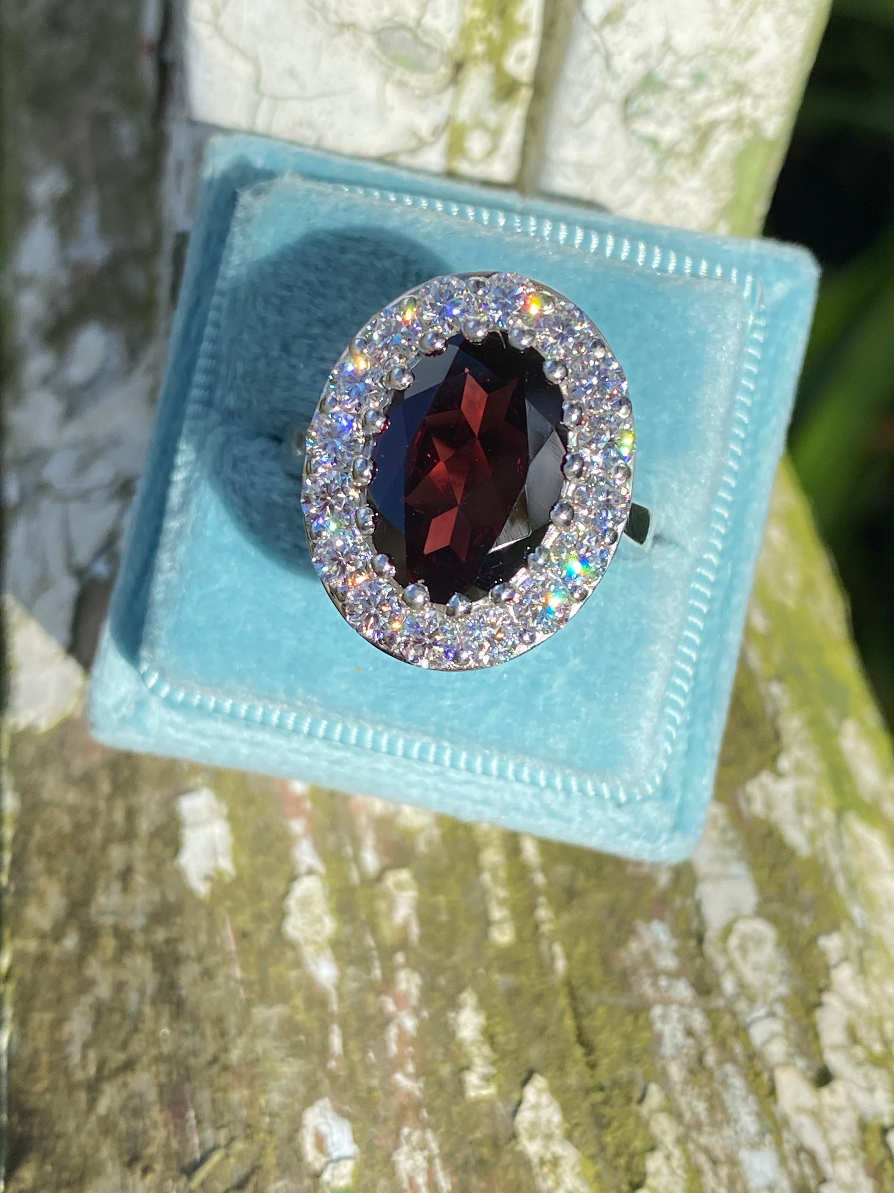 8.25 CTW Oval Cut Garnet and Moissanite Halo Cocktail Ring in Sterling Silver