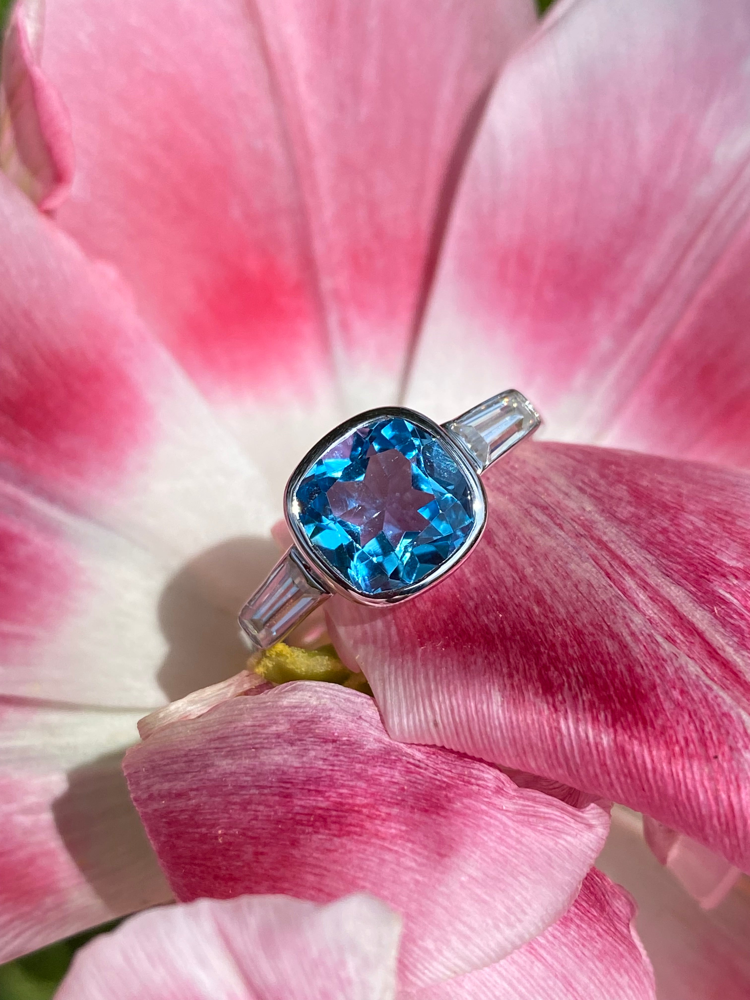 2.33 Carat Cushion Cut Blue Topaz and Moissanite Three Stone Ring in Sterling Silver