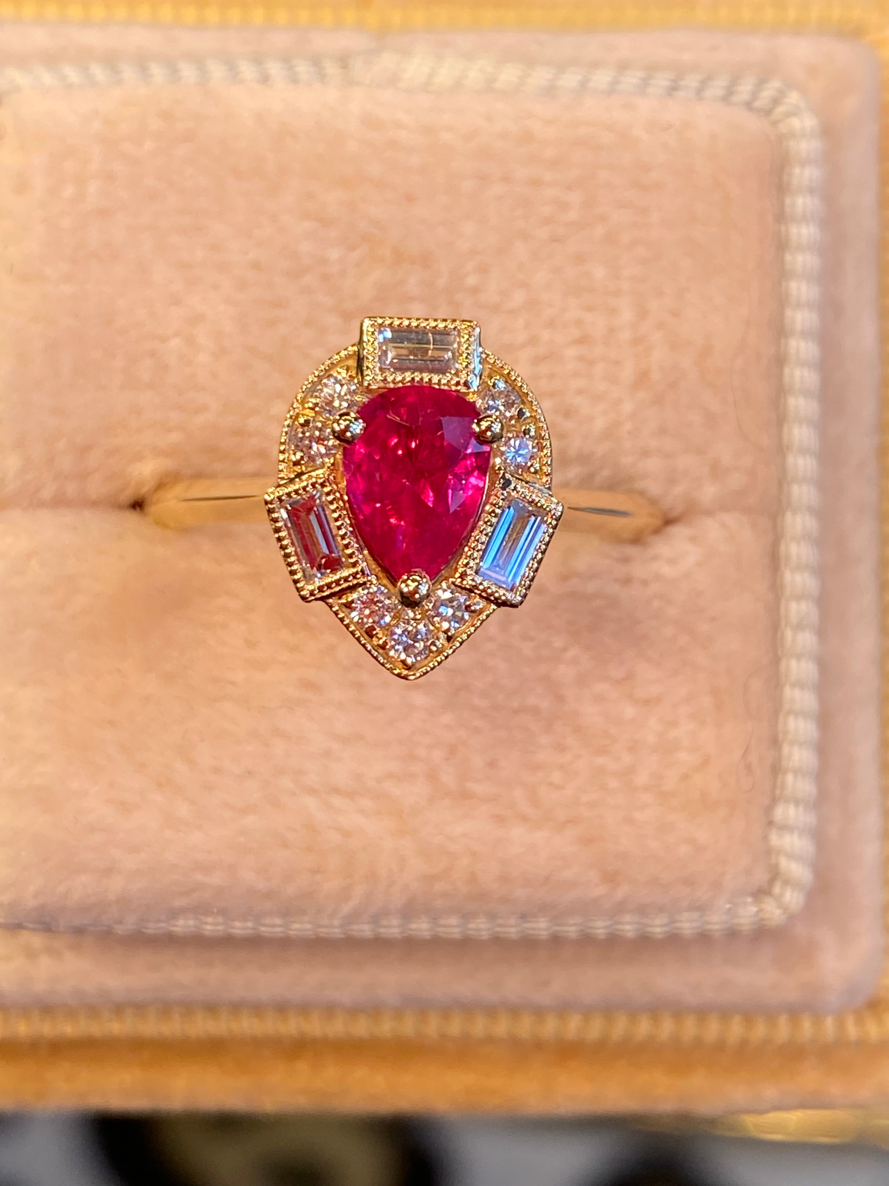 0.85 CTW Pear Cut Ruby and Natural Diamond Halo Ring in 18ct Yellow Gold