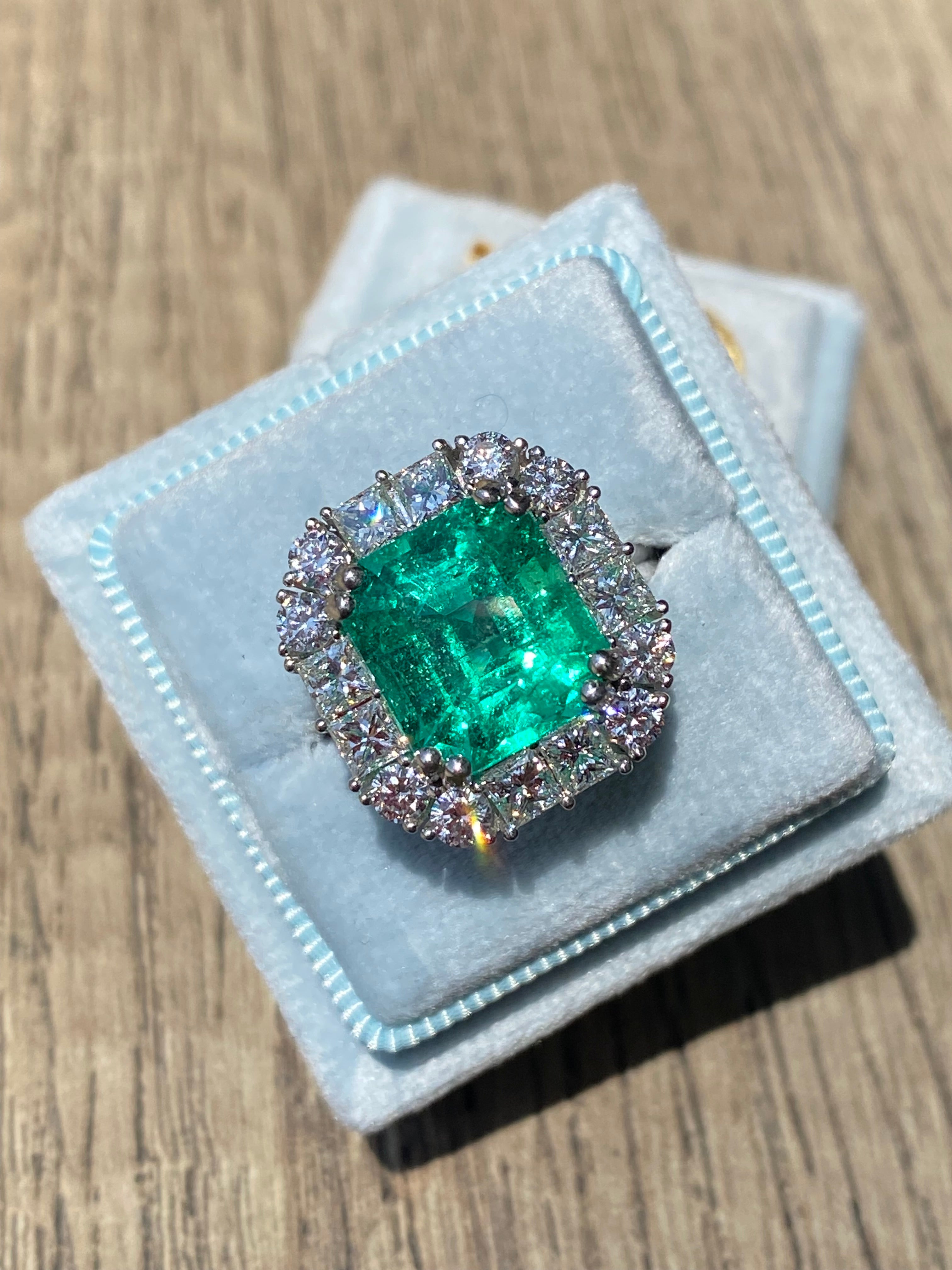 5.92 Carat Emerald Cut Colombian Emerald and Diamond Halo Ring in Platinum