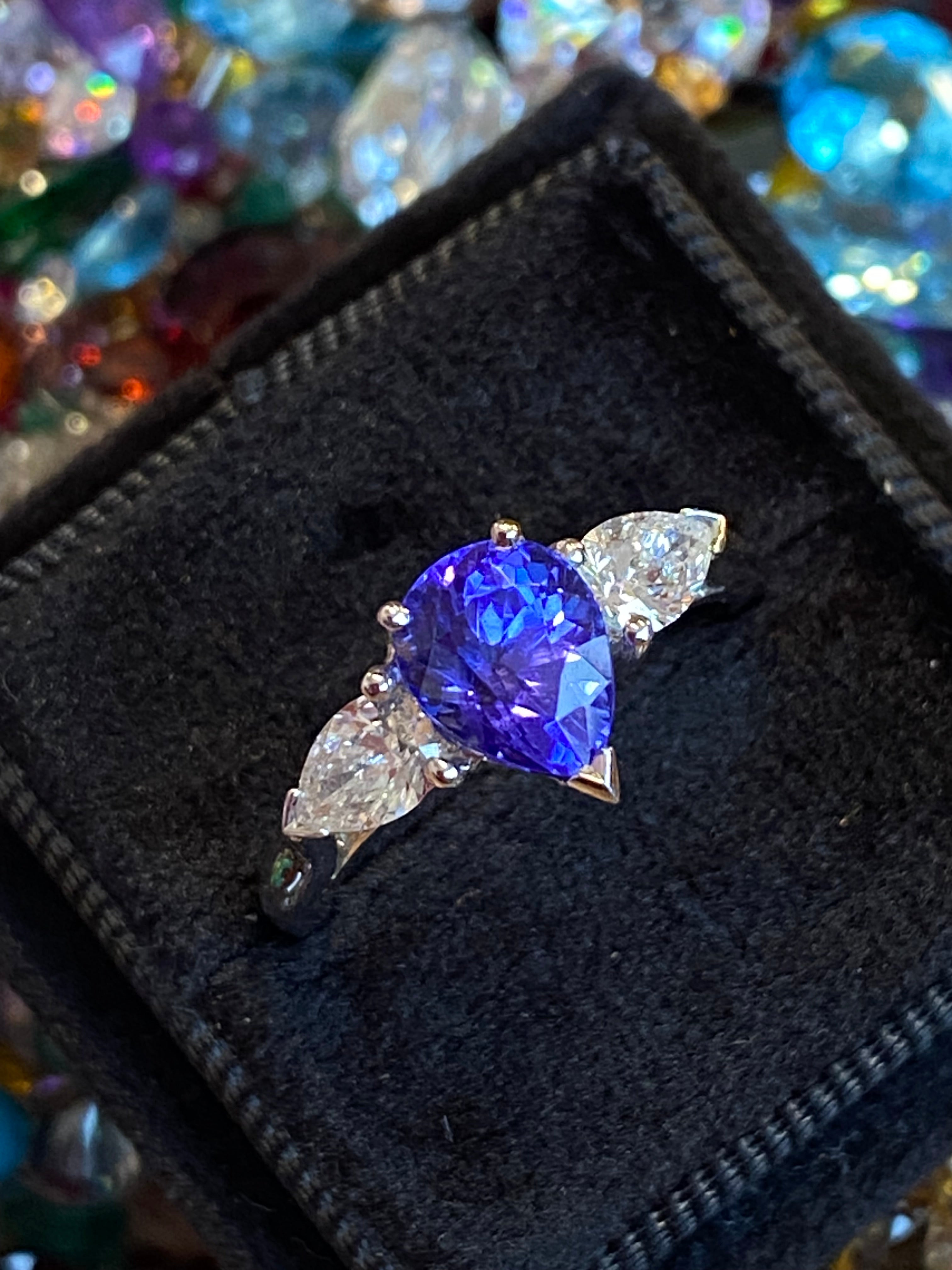 2.47 CTW Pear Cut Tanzanite and Natural Diamond Three Stone Ring in Platinum
