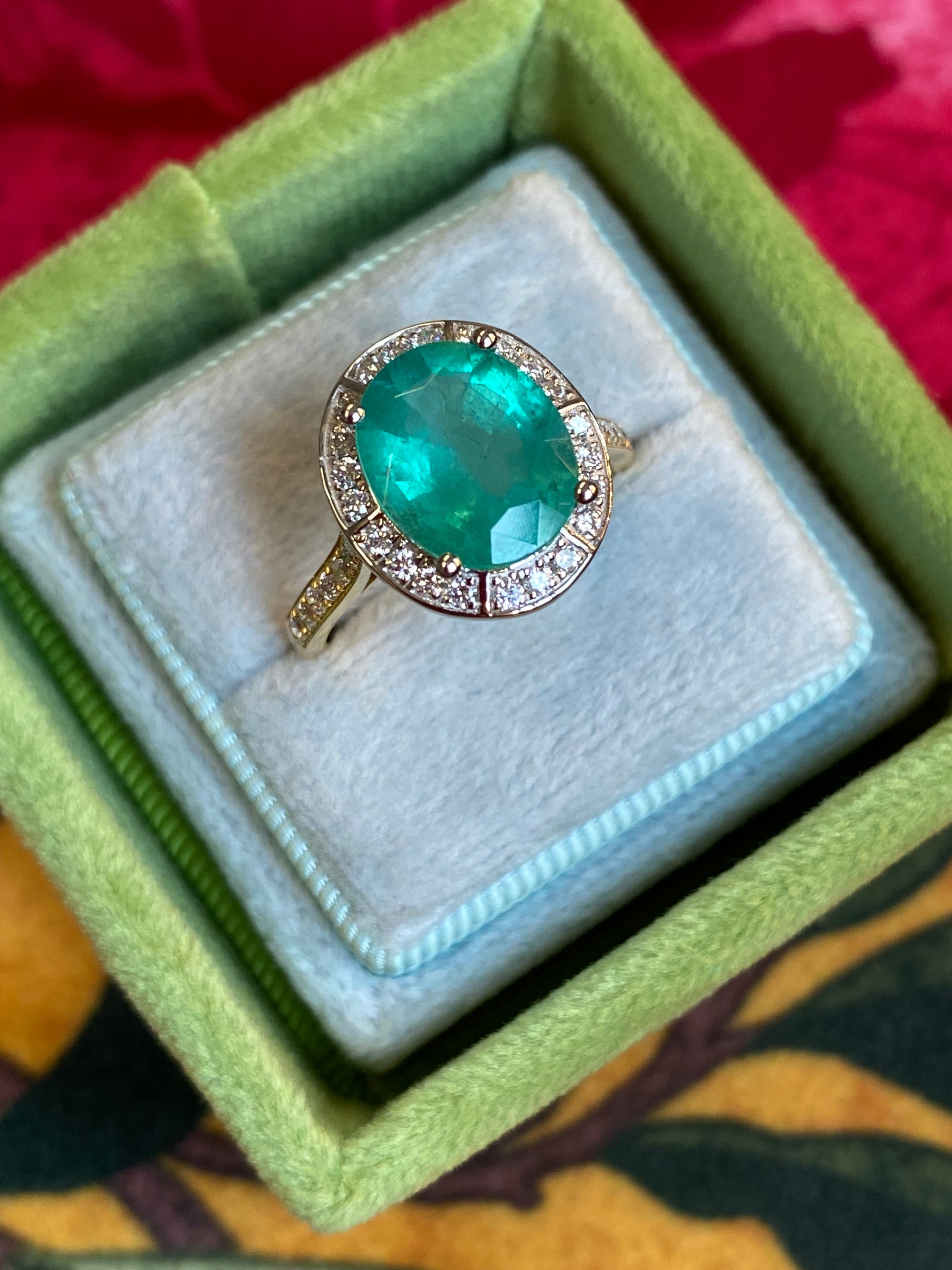 3.21 CTW Oval Cut Emerald and Natural Diamond Halo Engagement Ring in Platinum and 18ct Yellow Gold
