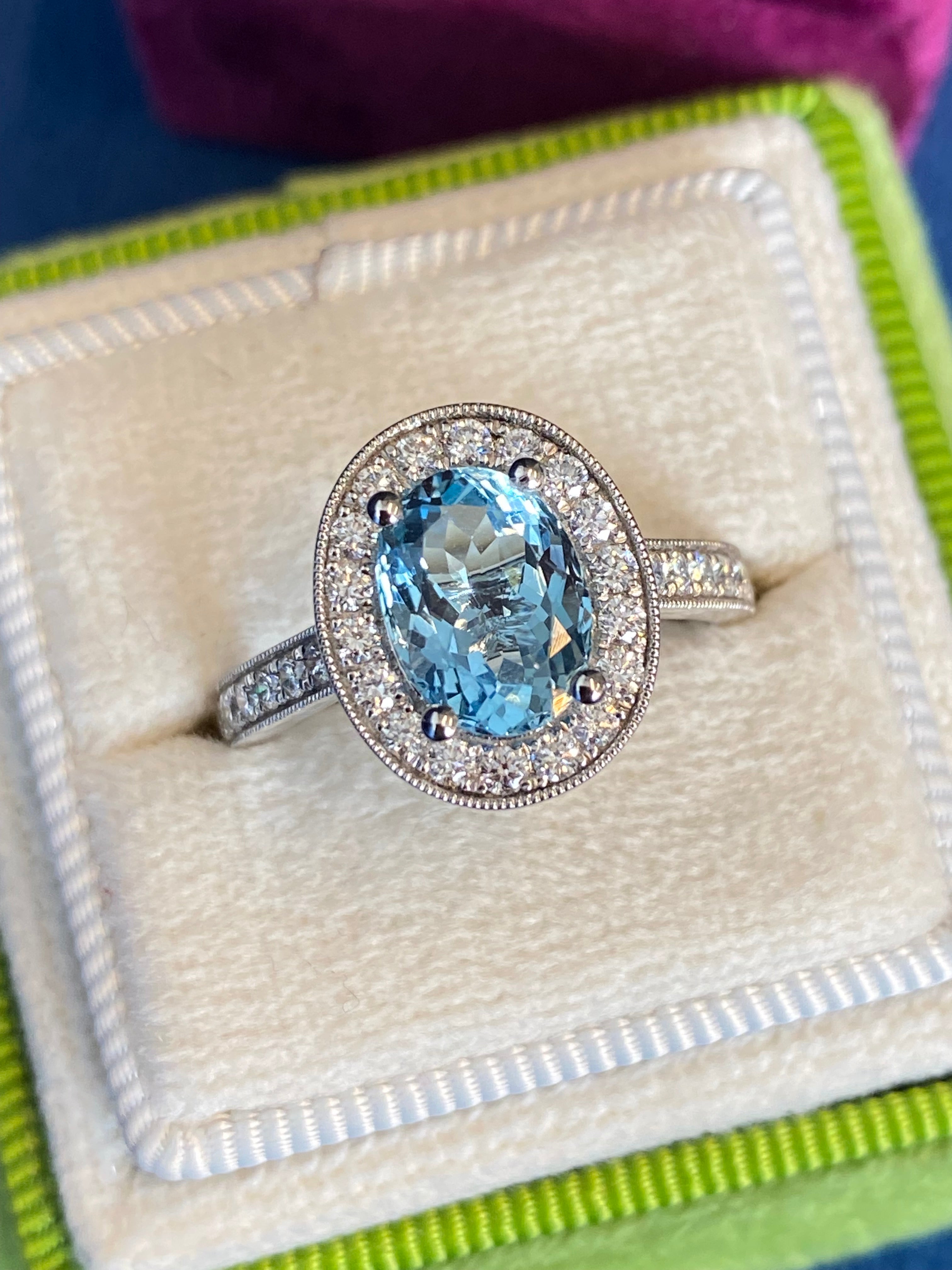 2.33 CTW Oval Cut Aquamarine and Natural Diamond Halo Engagement Ring in 18ct White Gold
