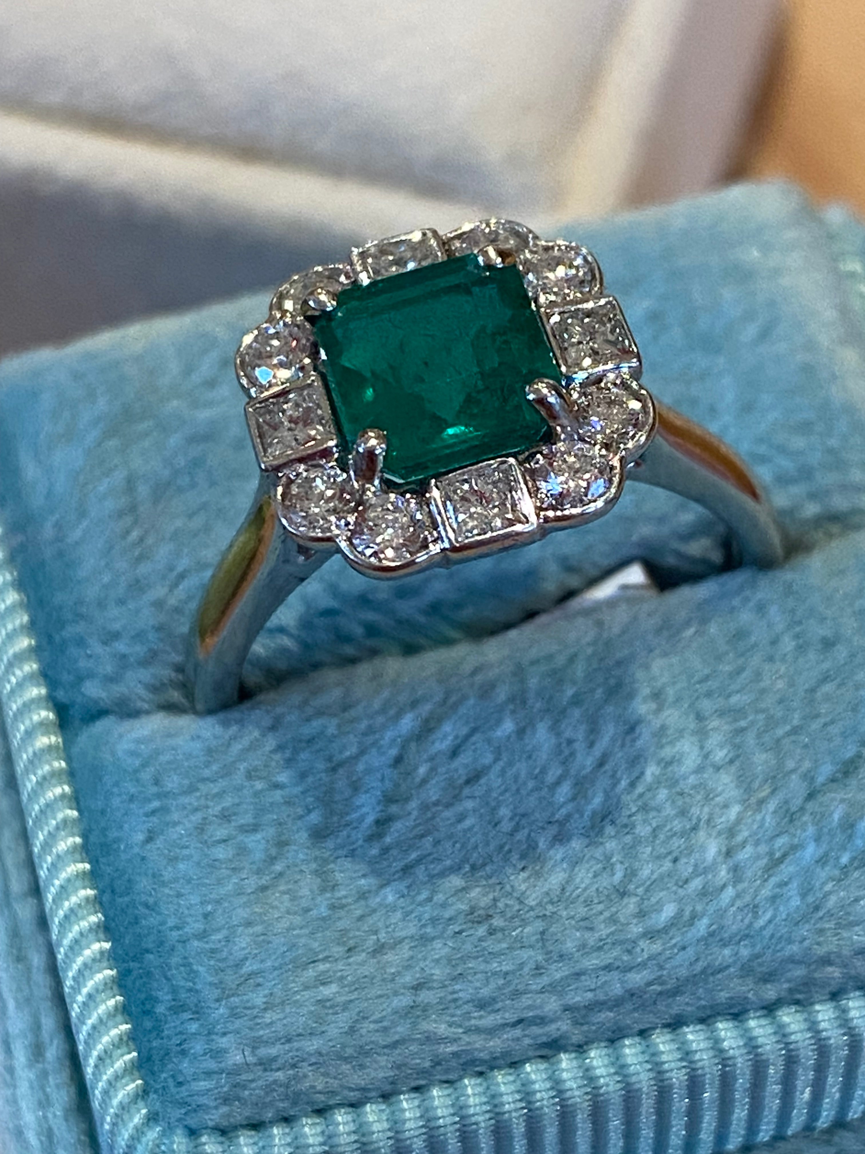 1.35 Carat Emerald Cut Emerald and 0.49 CTW Natural Diamond Halo Ring in Platinum