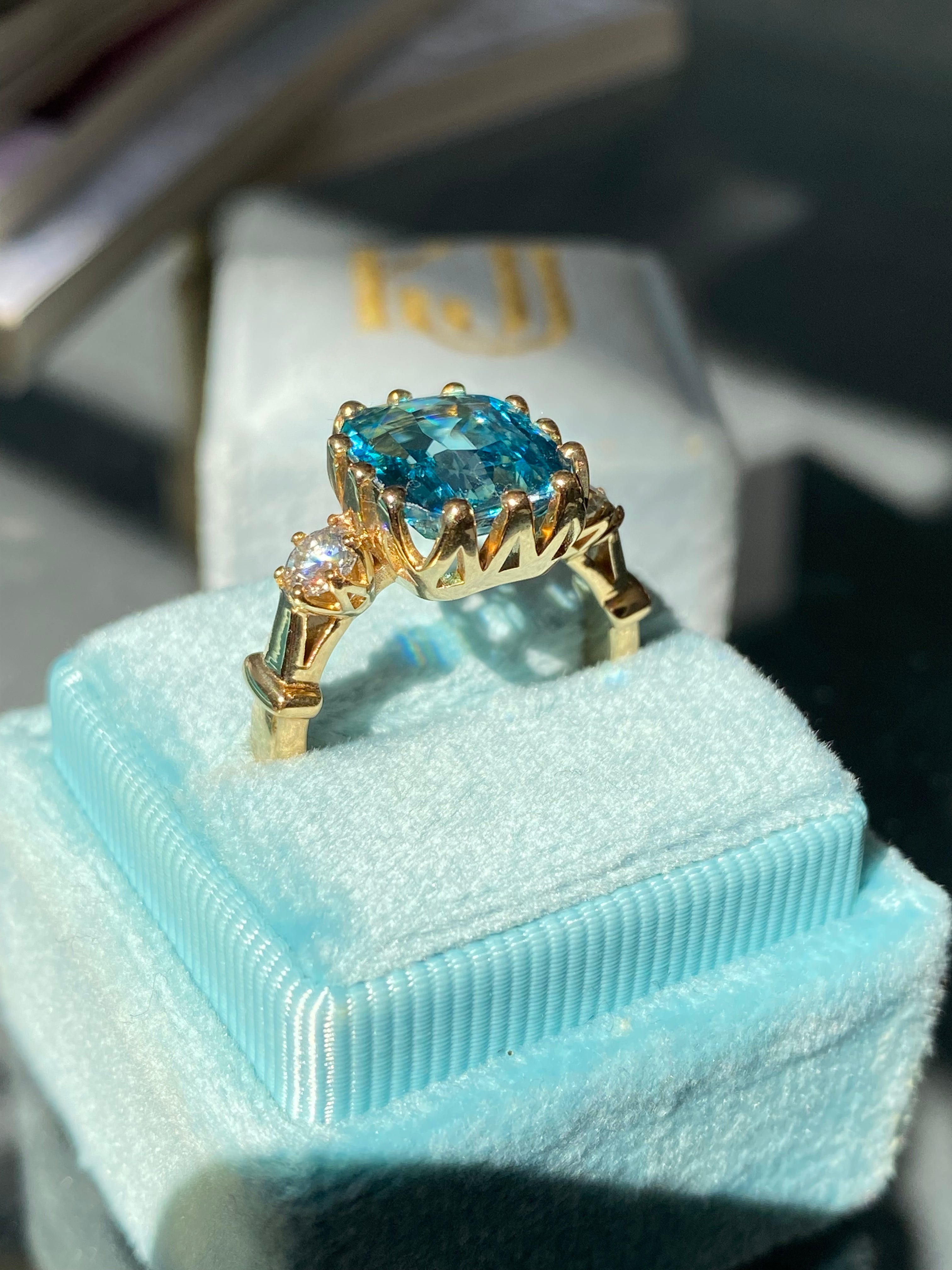 6.75 Carat Blue Zircon and Diamond Three Stone Ring in 18ct Yellow Gold