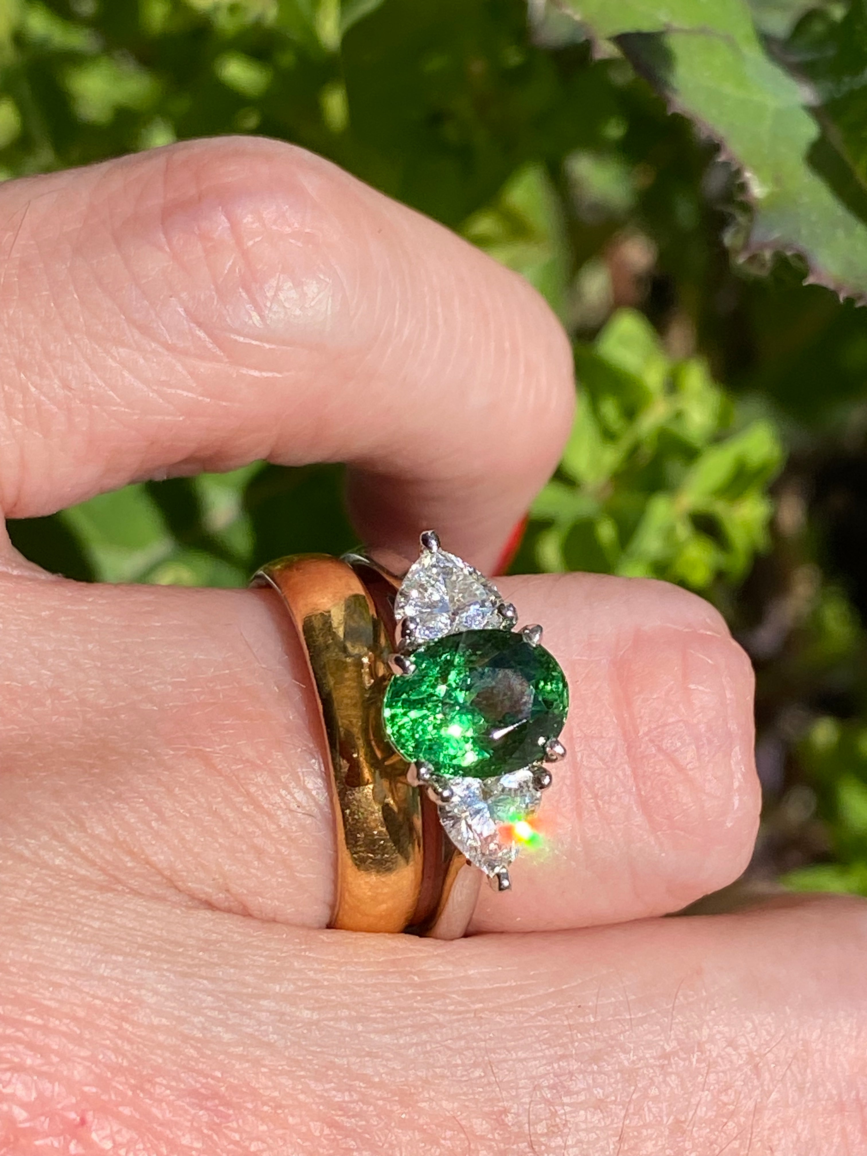 2.49 Carat Tsavorite Garnet and 0.83 Carat Diamond Three Stone Engagement Ring in Platinum