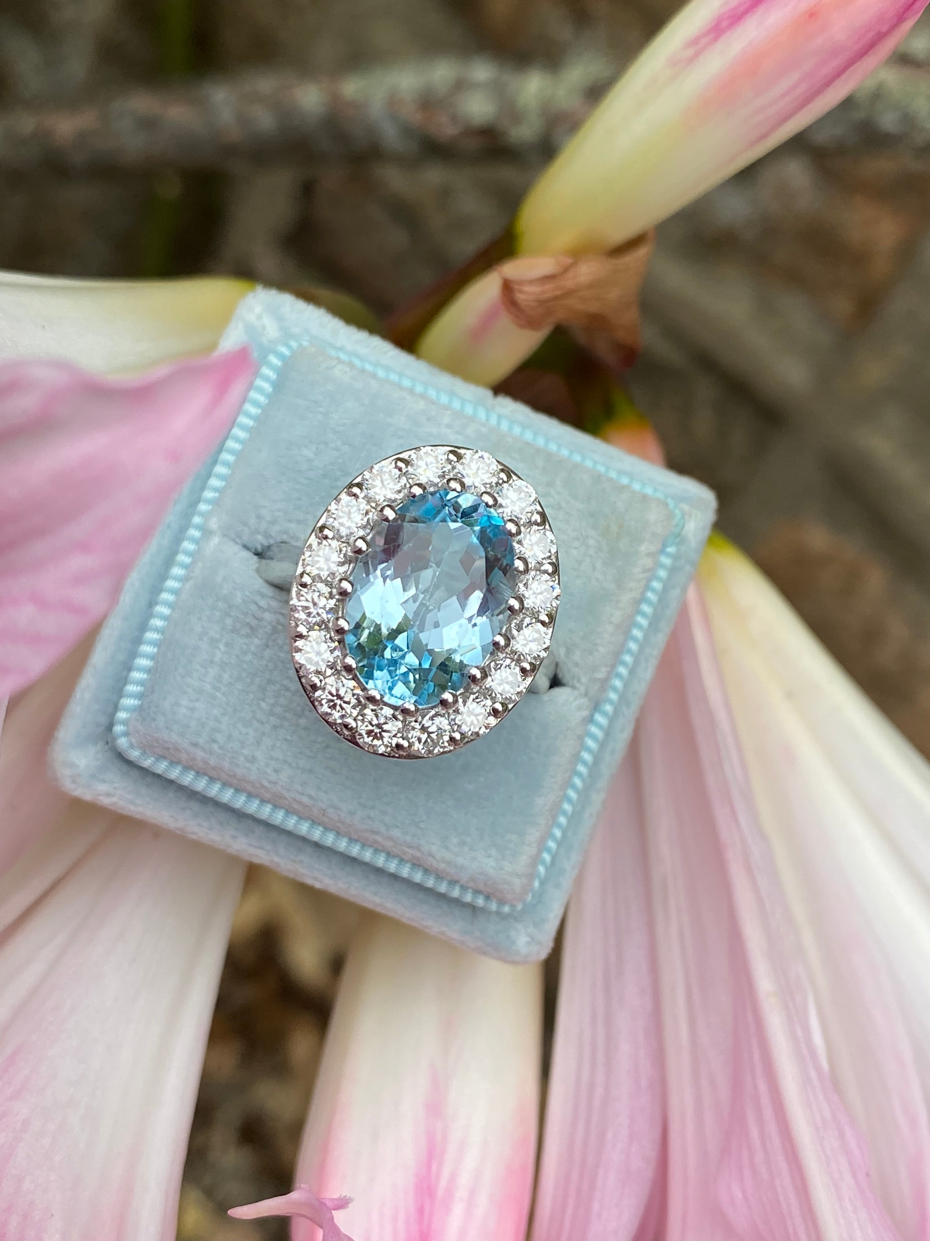 9.60 CTW Oval Cut Blue Topaz and Moissanite Halo Cocktail Ring in Sterling Silver