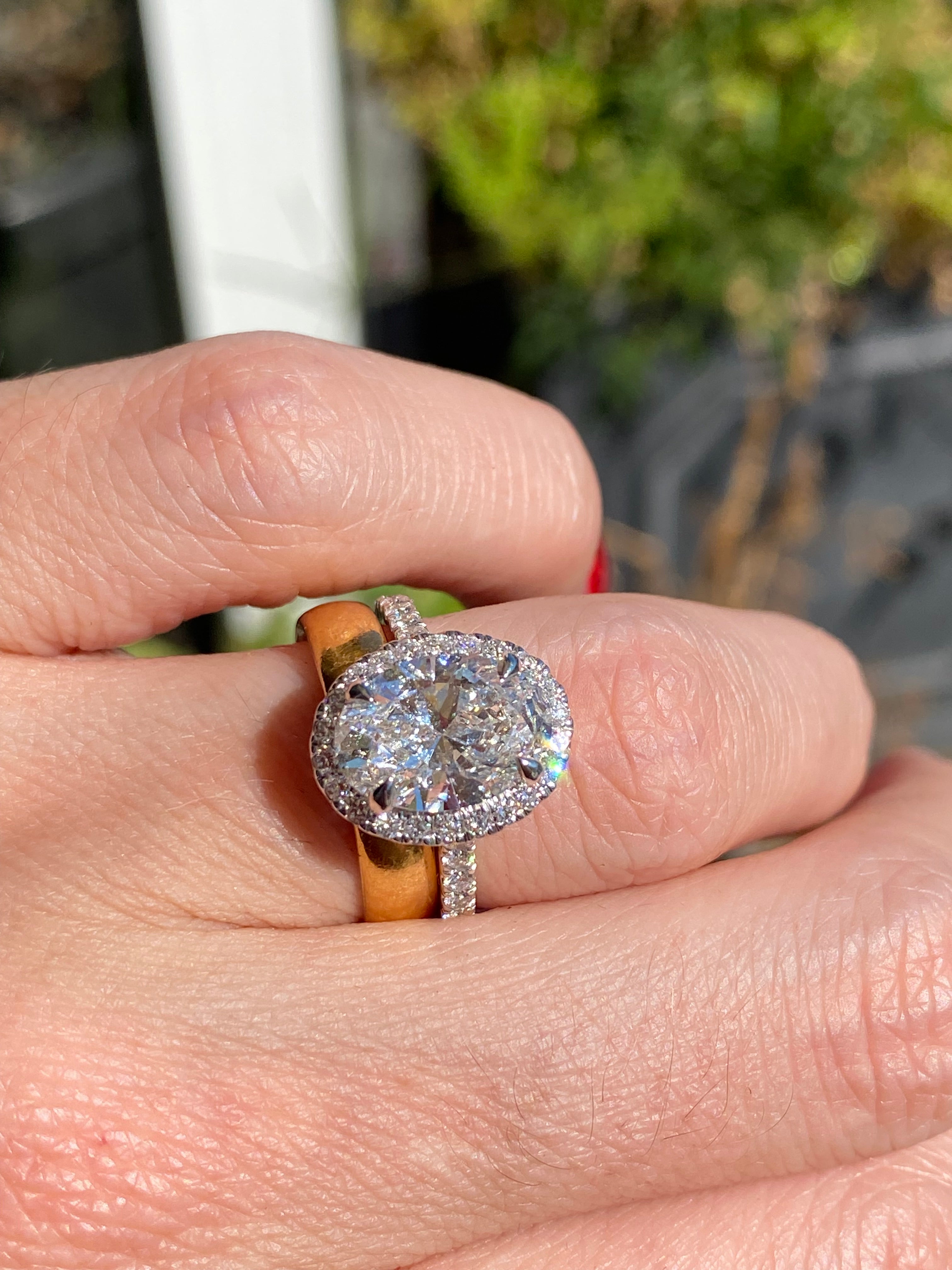 3.58 CTW Oval Cut Lab Diamond Halo Engagement Ring in Platinum