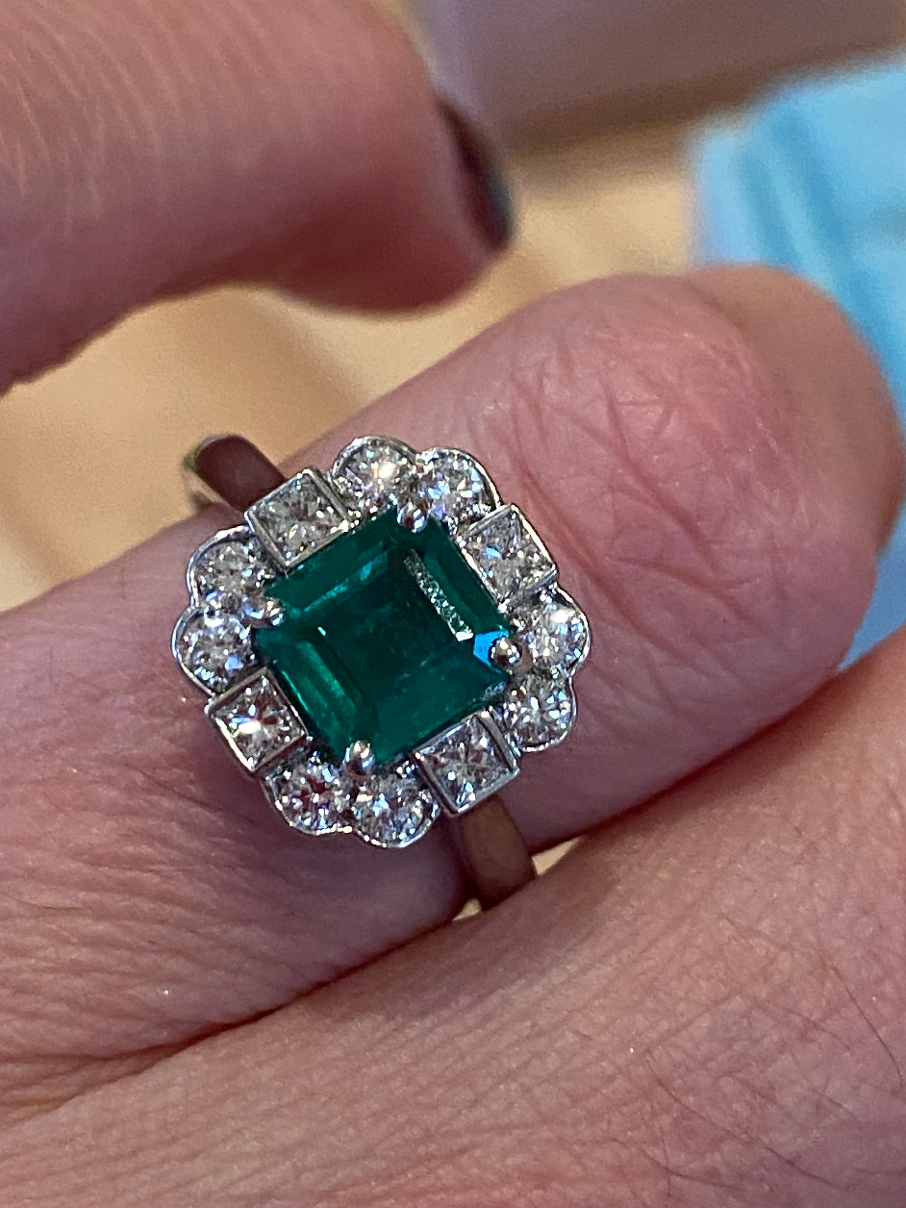 1.35 Carat Emerald Cut Emerald and 0.49 CTW Natural Diamond Halo Ring in Platinum