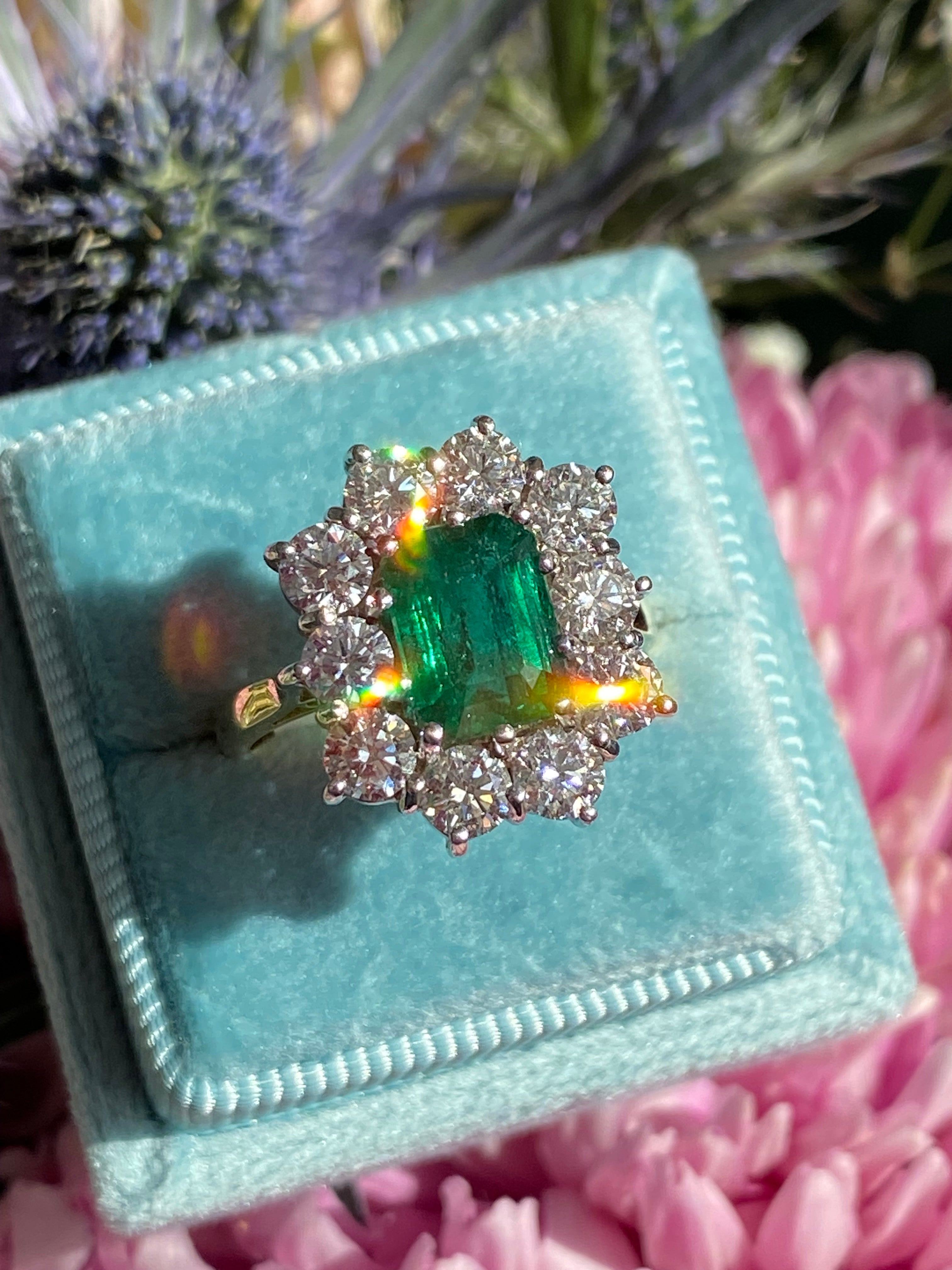 Outrageously Fantastic 4.17 CTW Emerald and Diamond Halo Ring in 18ct White and Yellow Gold