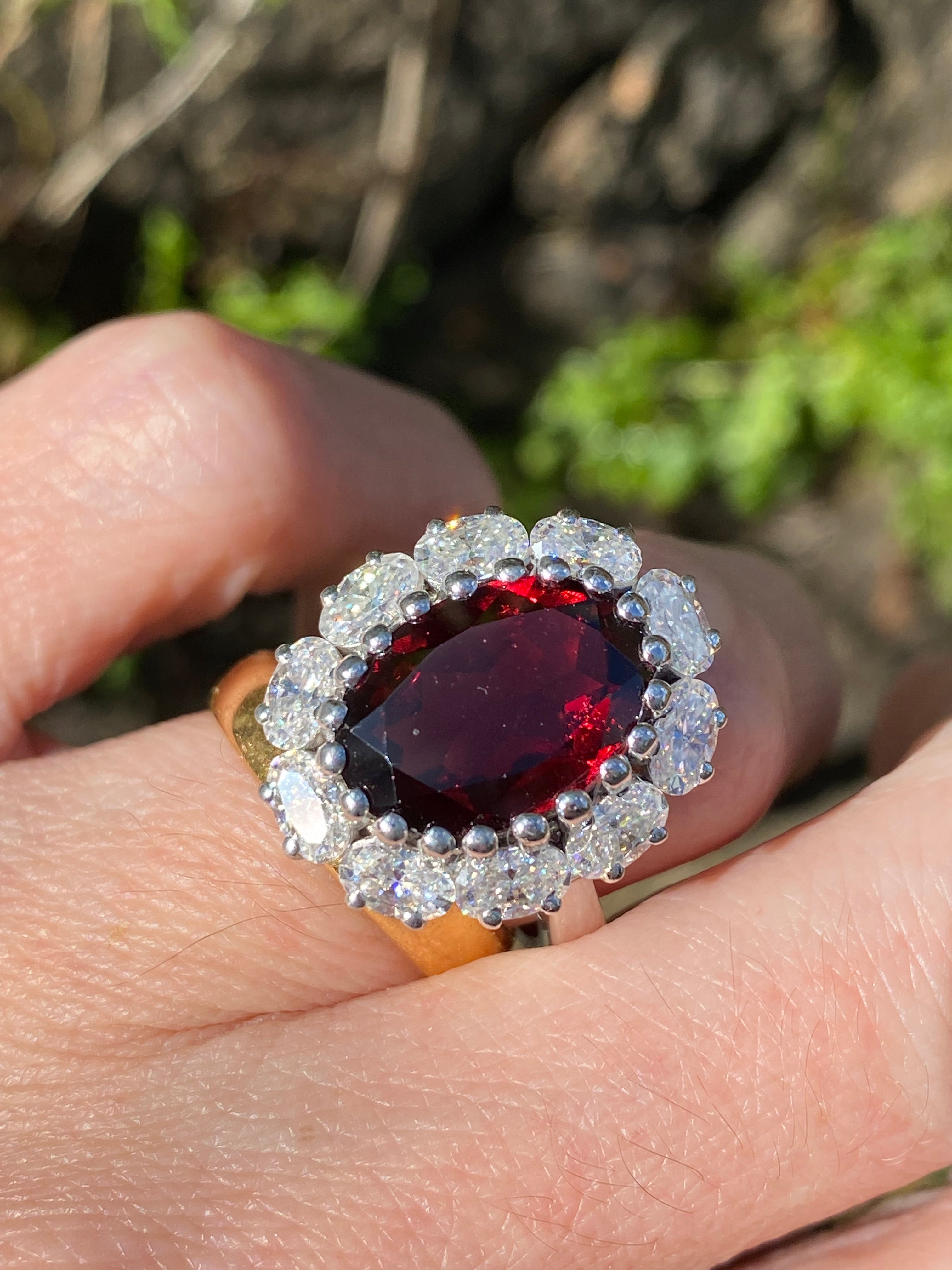 8.17 CTW Oval Cut Garnet and Moissanite Halo Cocktail Ring
