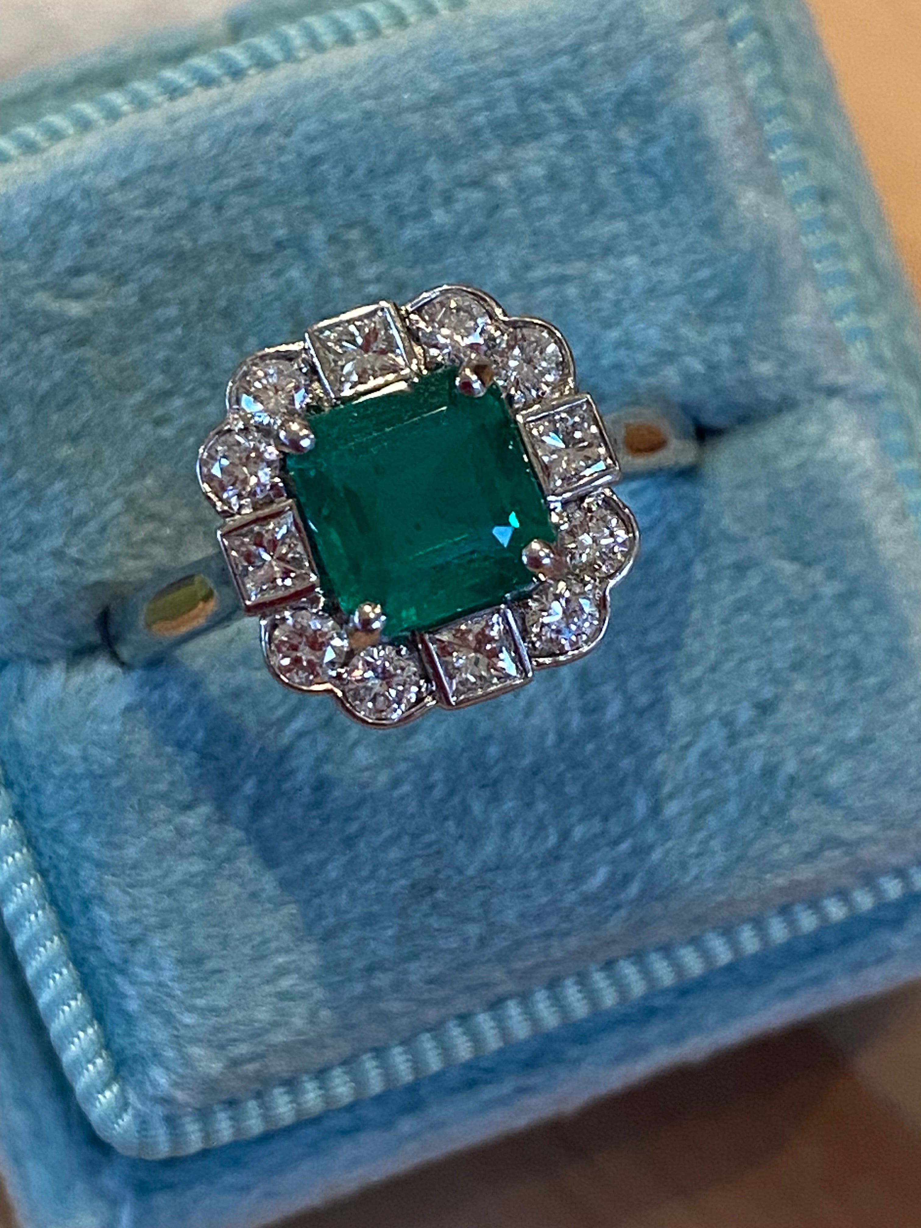1.35 Carat Emerald Cut Emerald and 0.49 CTW Natural Diamond Halo Ring in Platinum