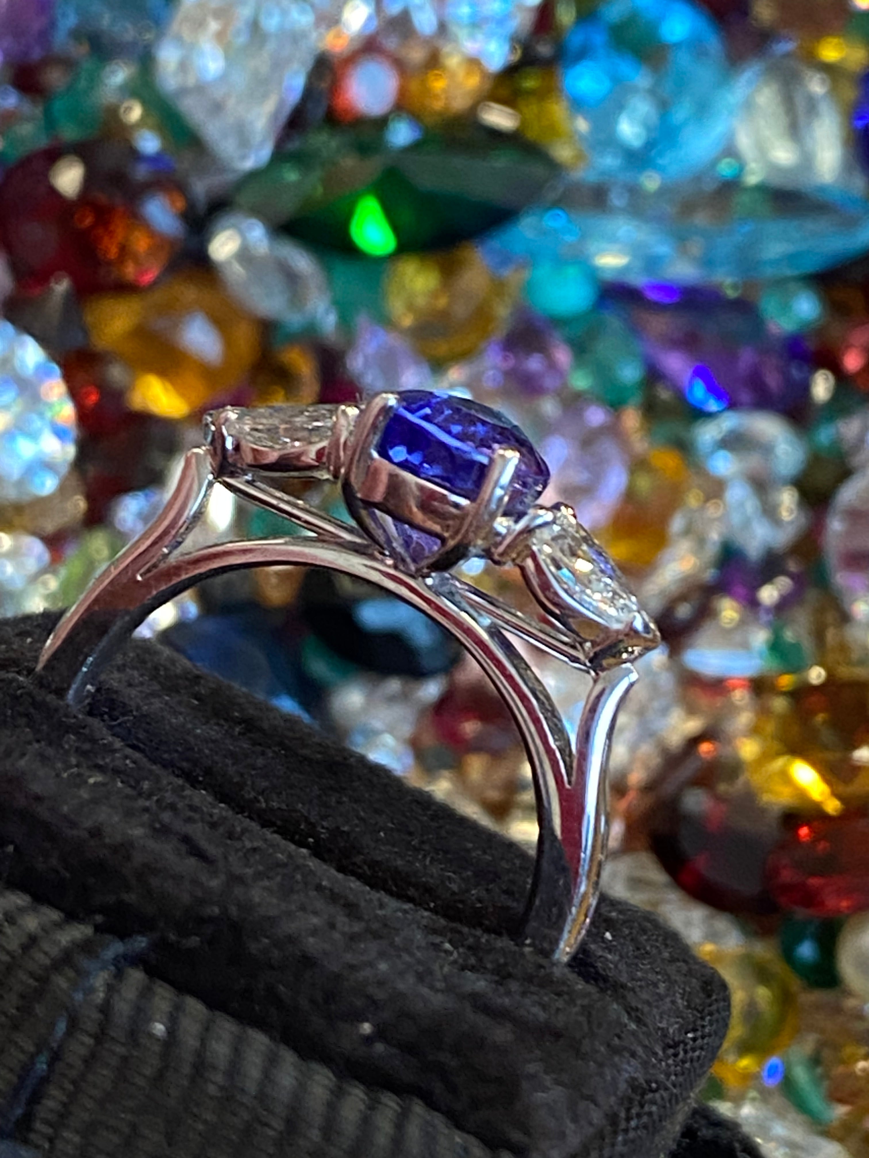 2.47 CTW Pear Cut Tanzanite and Natural Diamond Three Stone Ring in Platinum