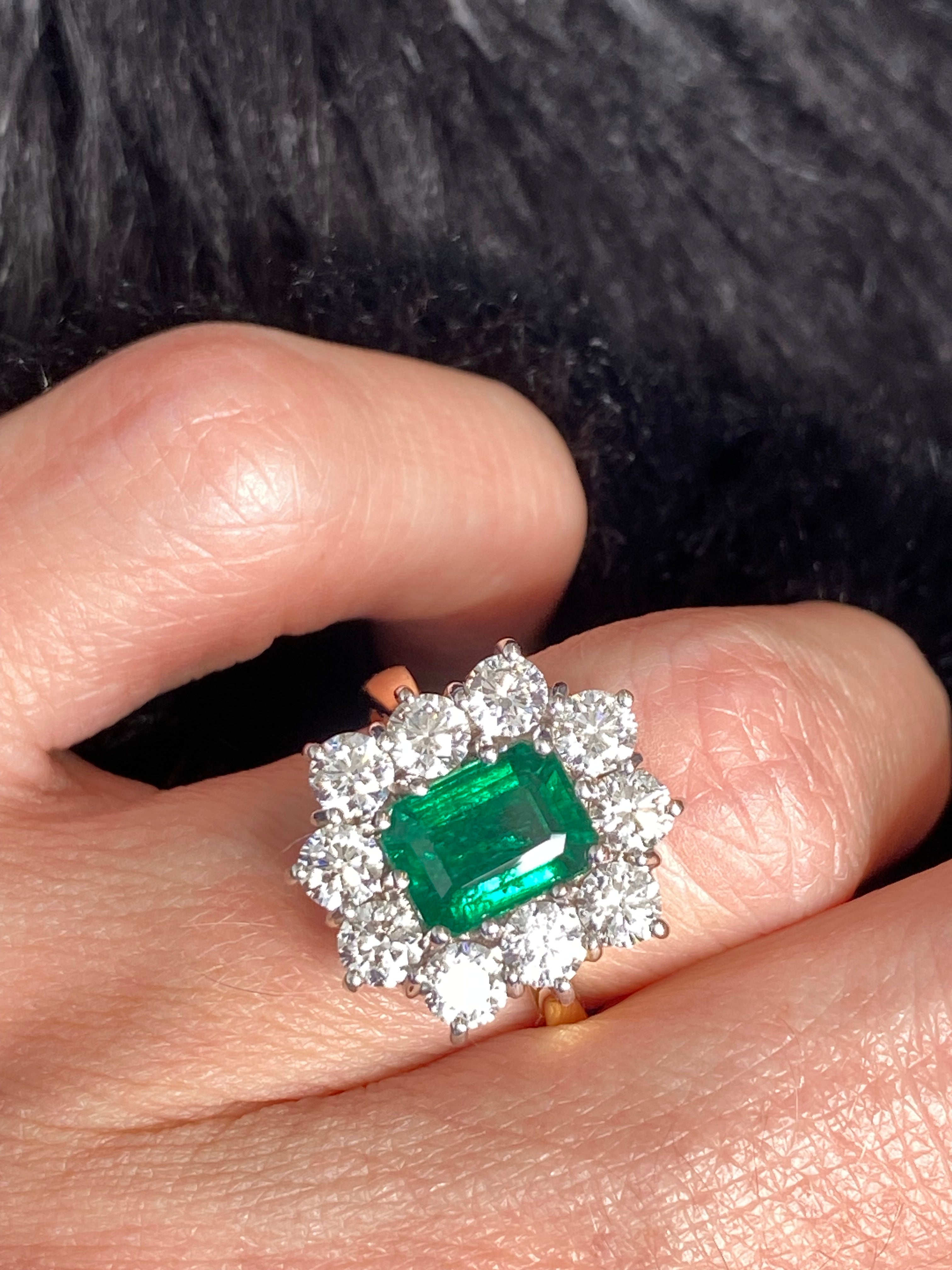 Outrageously Fantastic 4.17 CTW Emerald and Diamond Halo Ring in 18ct White and Yellow Gold