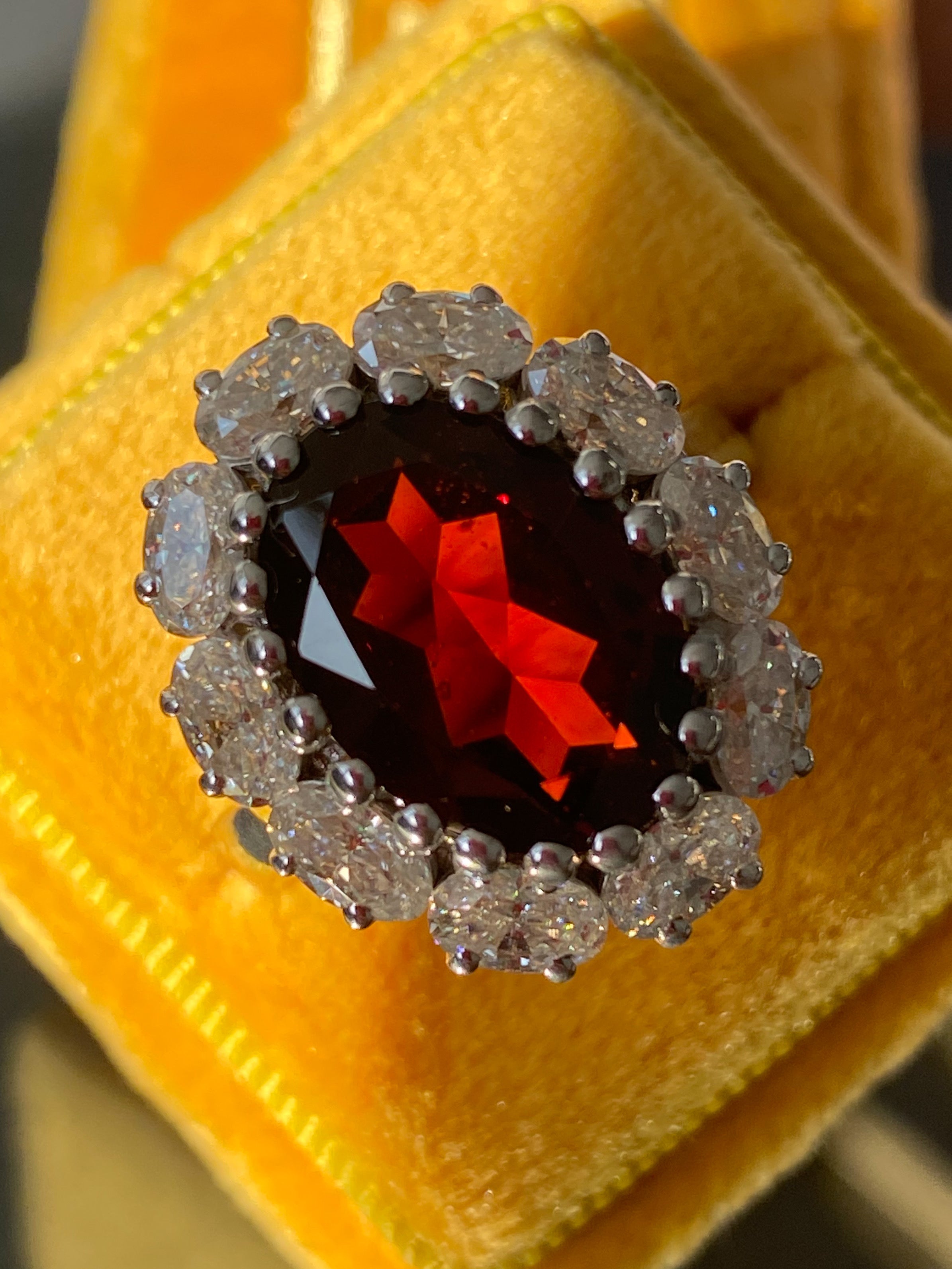 7.25 CTW Oval Cut Garnet and Moissanite Halo Cocktail Ring in Sterling Silver