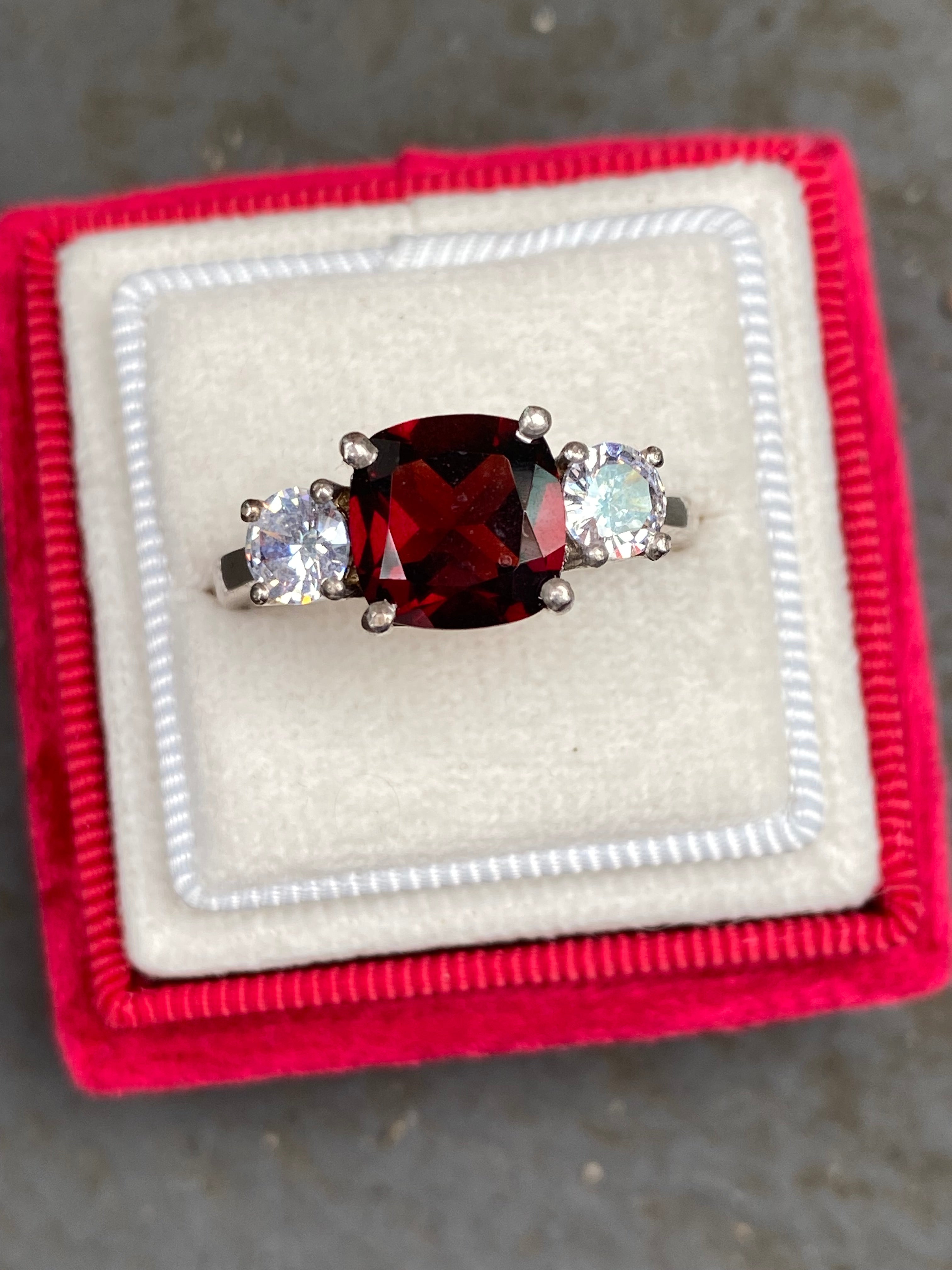 4.00 CTW Cushion Cut Garnet and Moissanite Three Stone Ring in Sterling Silver