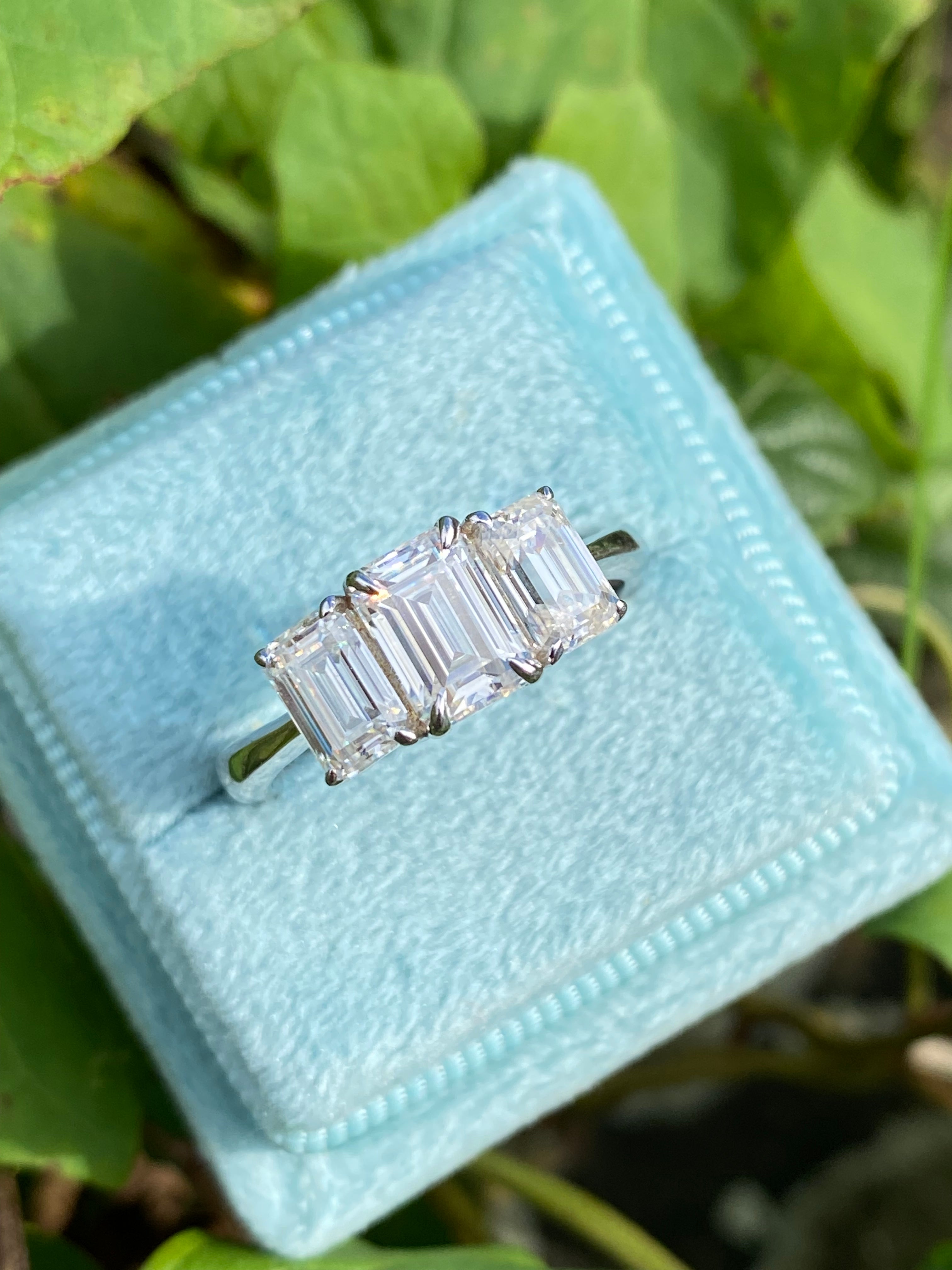2.00 CTW Emerald Cut Moissanite Three Stone Engagement Ring in Sterling Silver