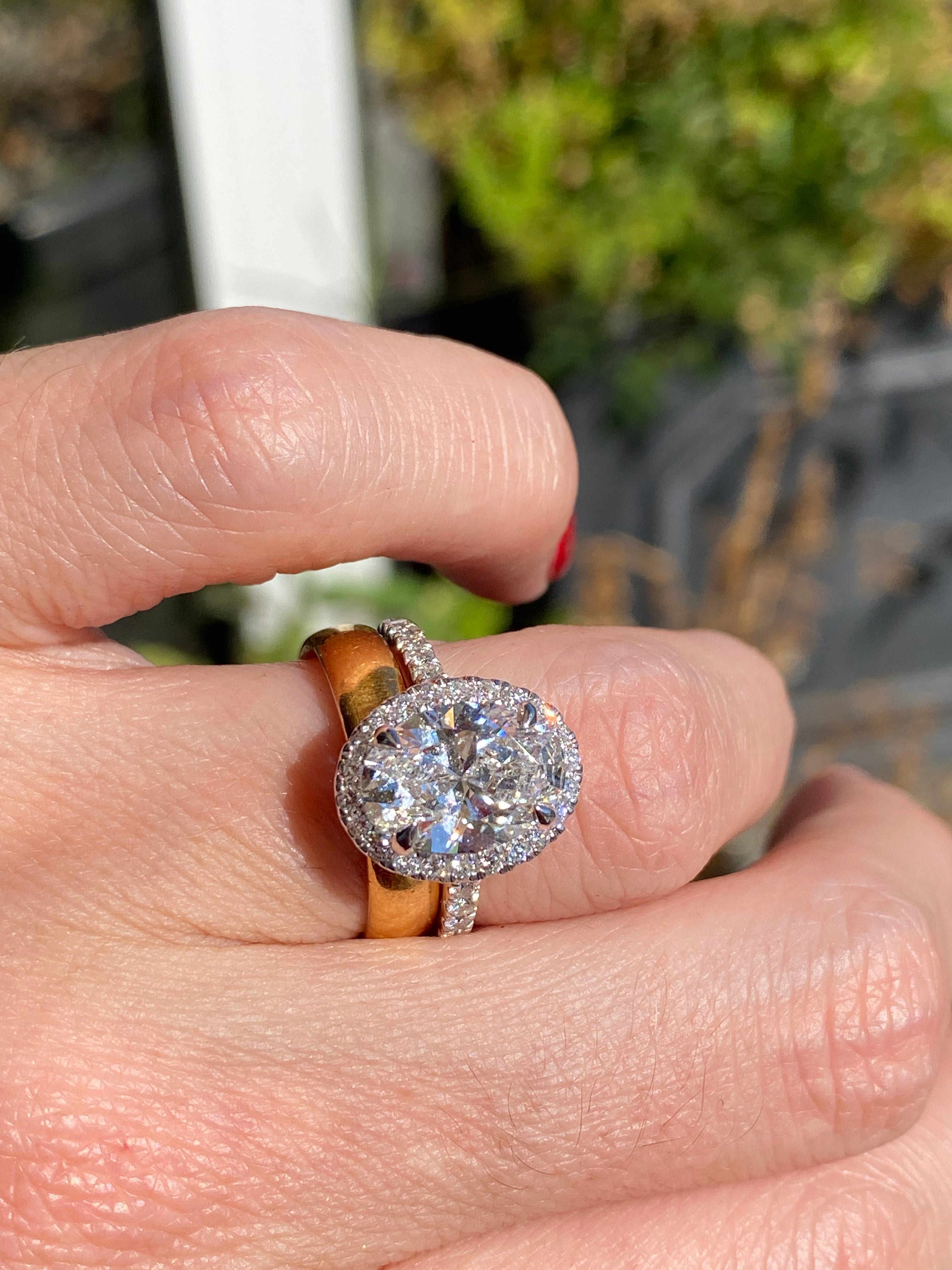 3.58 CTW Oval Cut Lab Diamond Halo Engagement Ring in Platinum