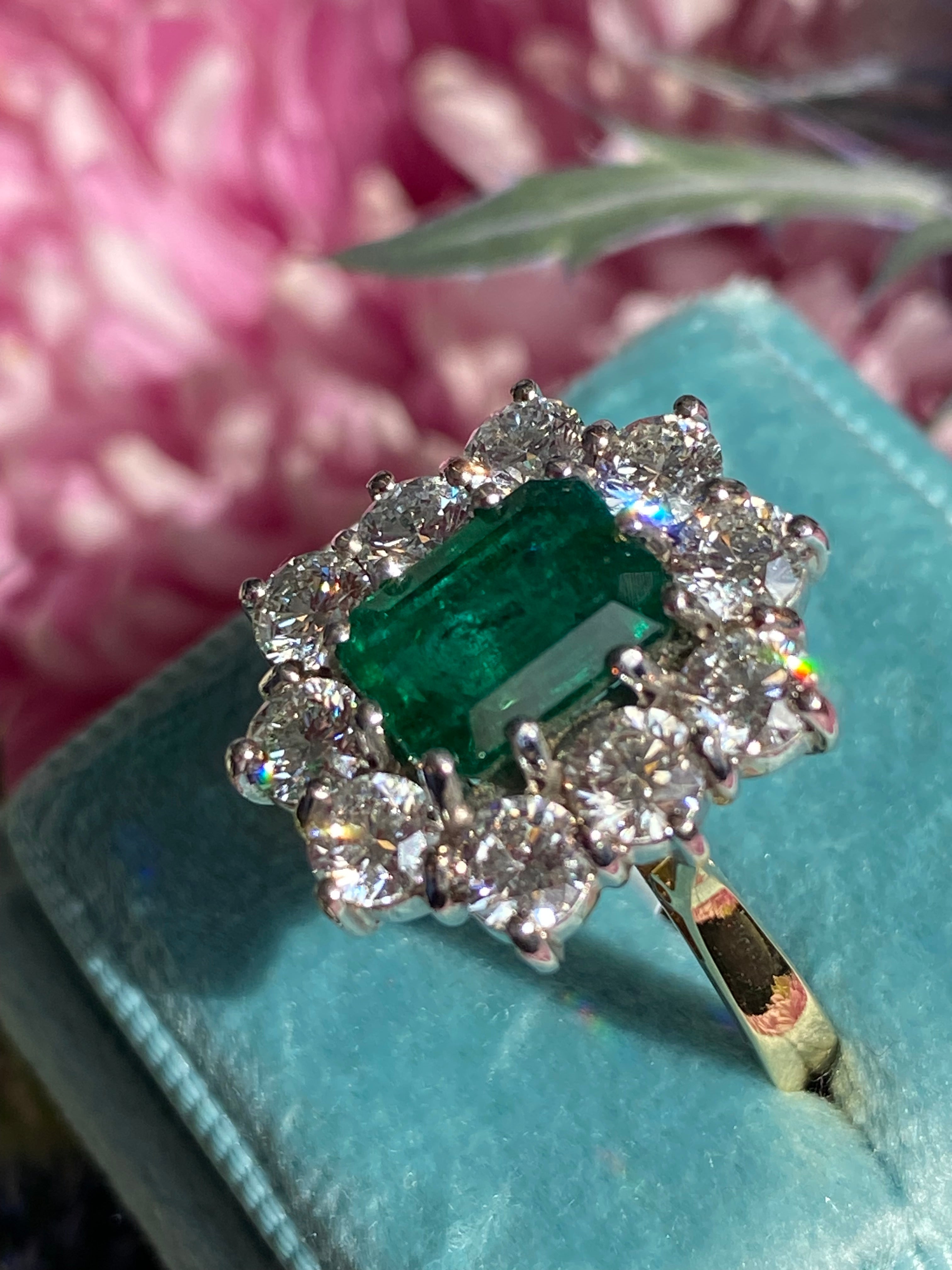 Outrageously Fantastic 4.17 CTW Emerald and Diamond Halo Ring in 18ct White and Yellow Gold