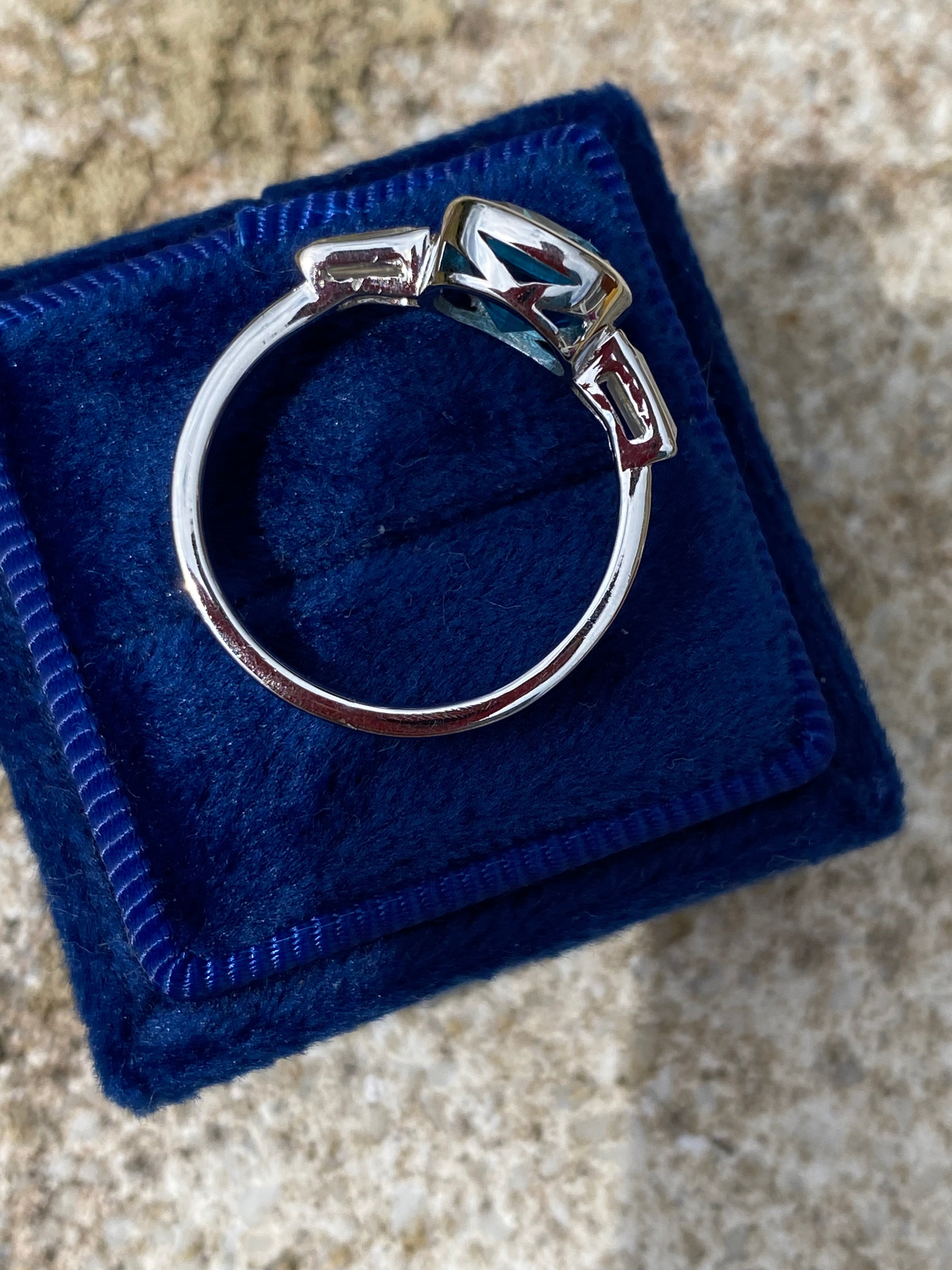 2.33 Carat Cushion Cut Blue Topaz and Moissanite Three Stone Ring in Sterling Silver