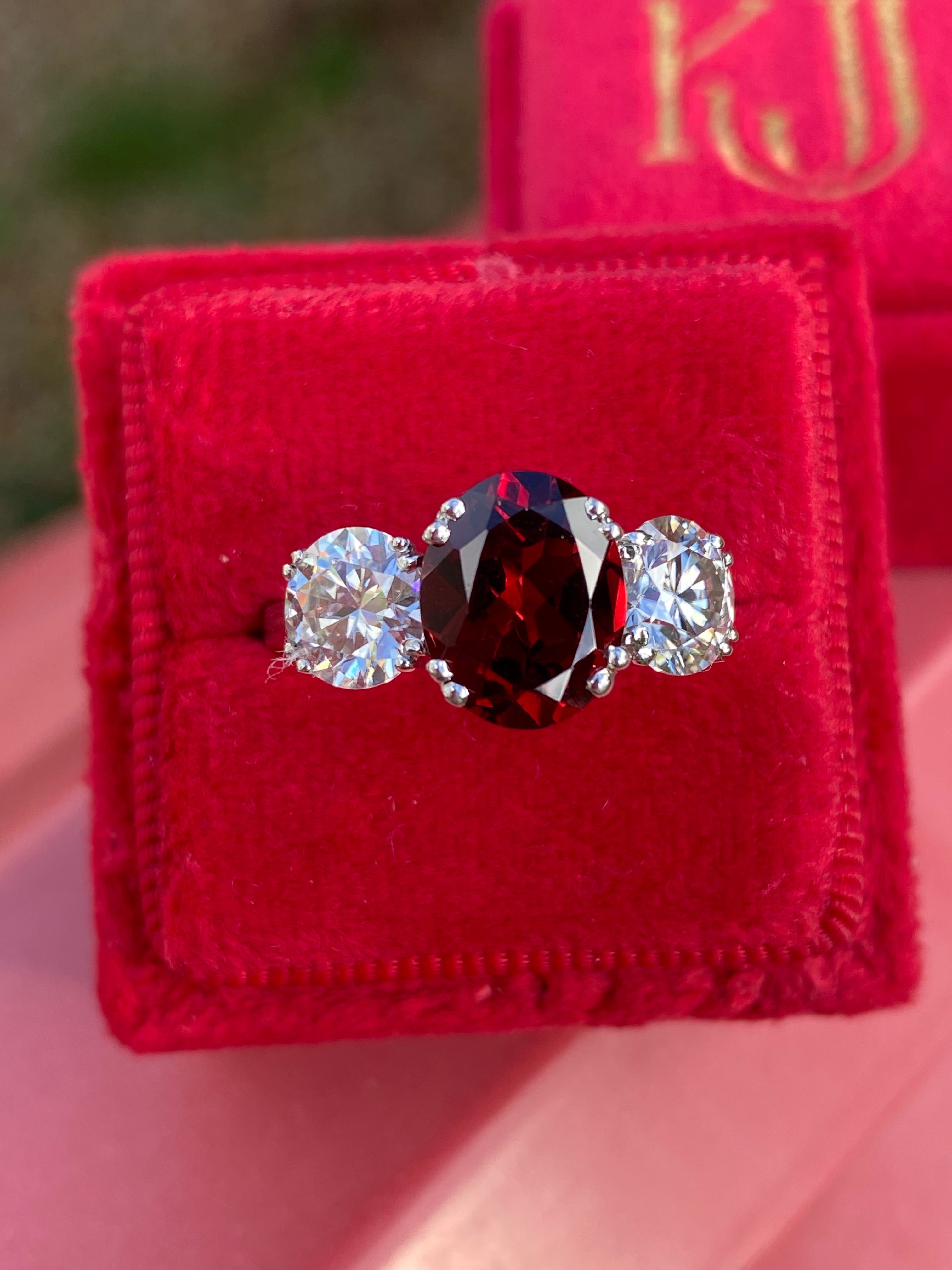 2.57 Carat Garnet and 1.84 Carat Moissanite Three Stone Ring in Sterling Silver