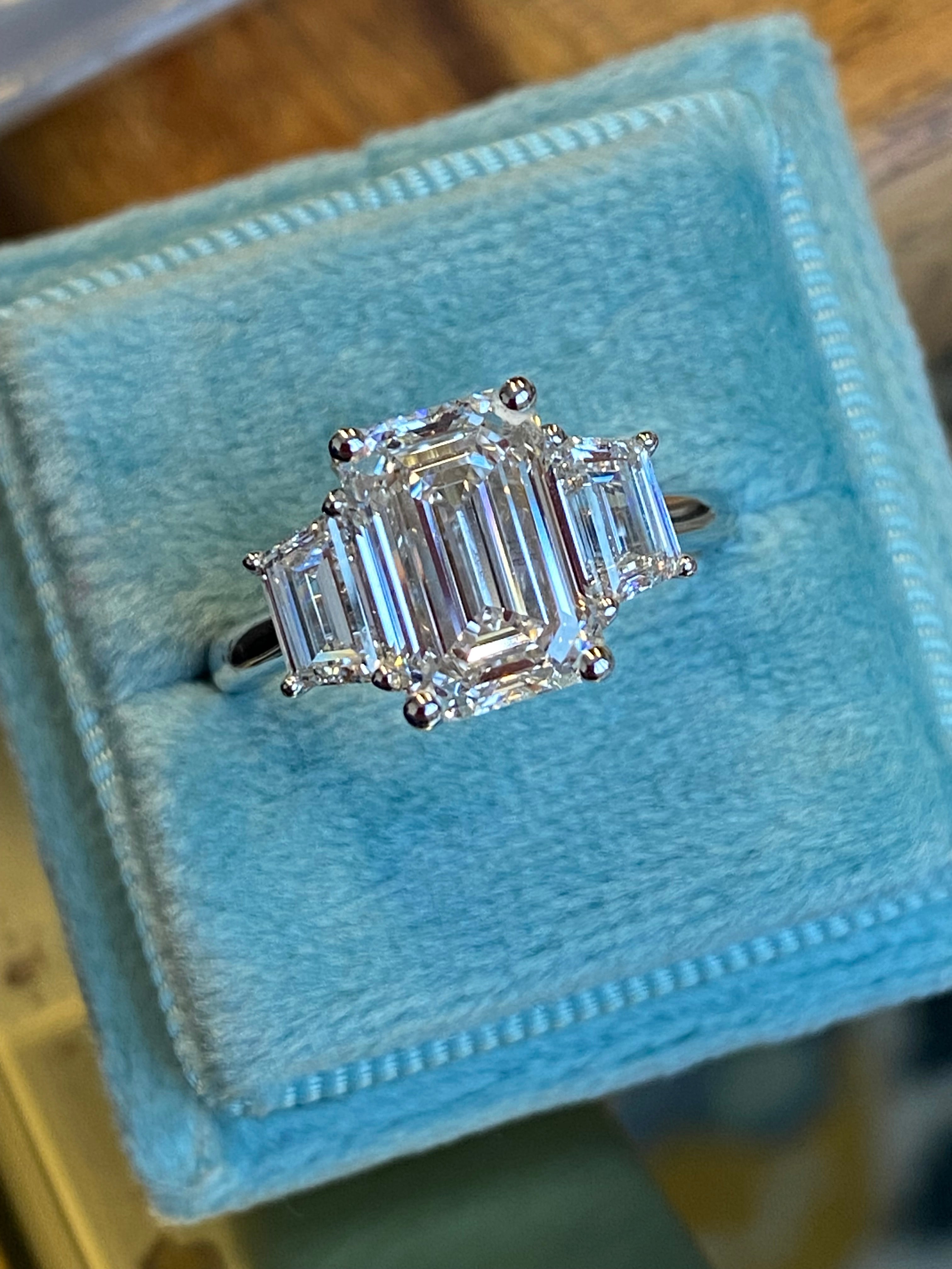 3.93 CTW Emerald and Trapezoid Cut D Colour VS1 Lab Diamond Three Stone Ring in Platinum