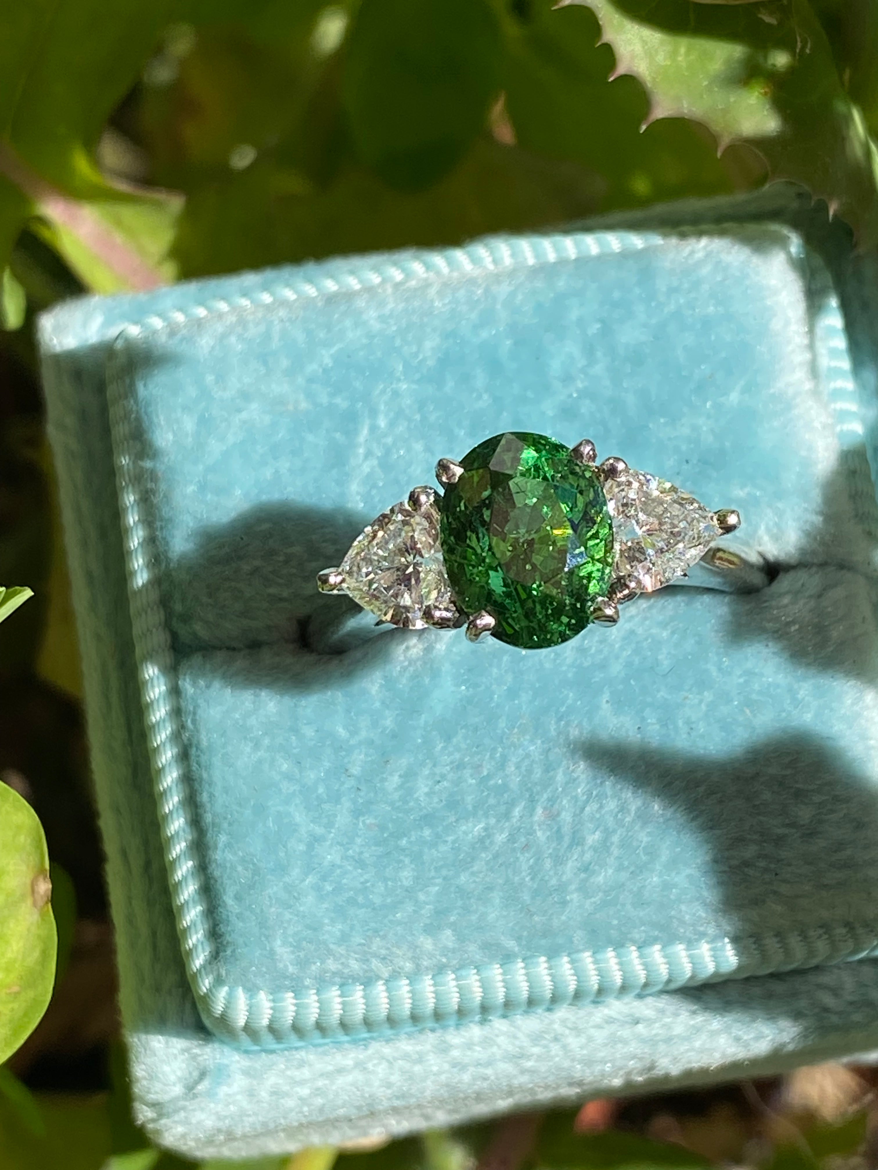 2.49 Carat Tsavorite Garnet and 0.83 Carat Diamond Three Stone Engagement Ring in Platinum