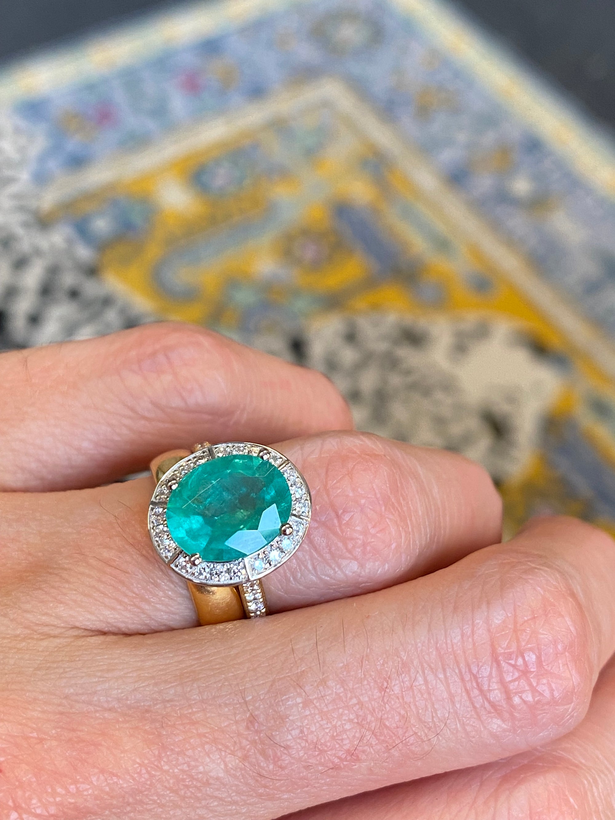 3.21 CTW Oval Cut Emerald and Natural Diamond Halo Engagement Ring in Platinum and 18ct Yellow Gold