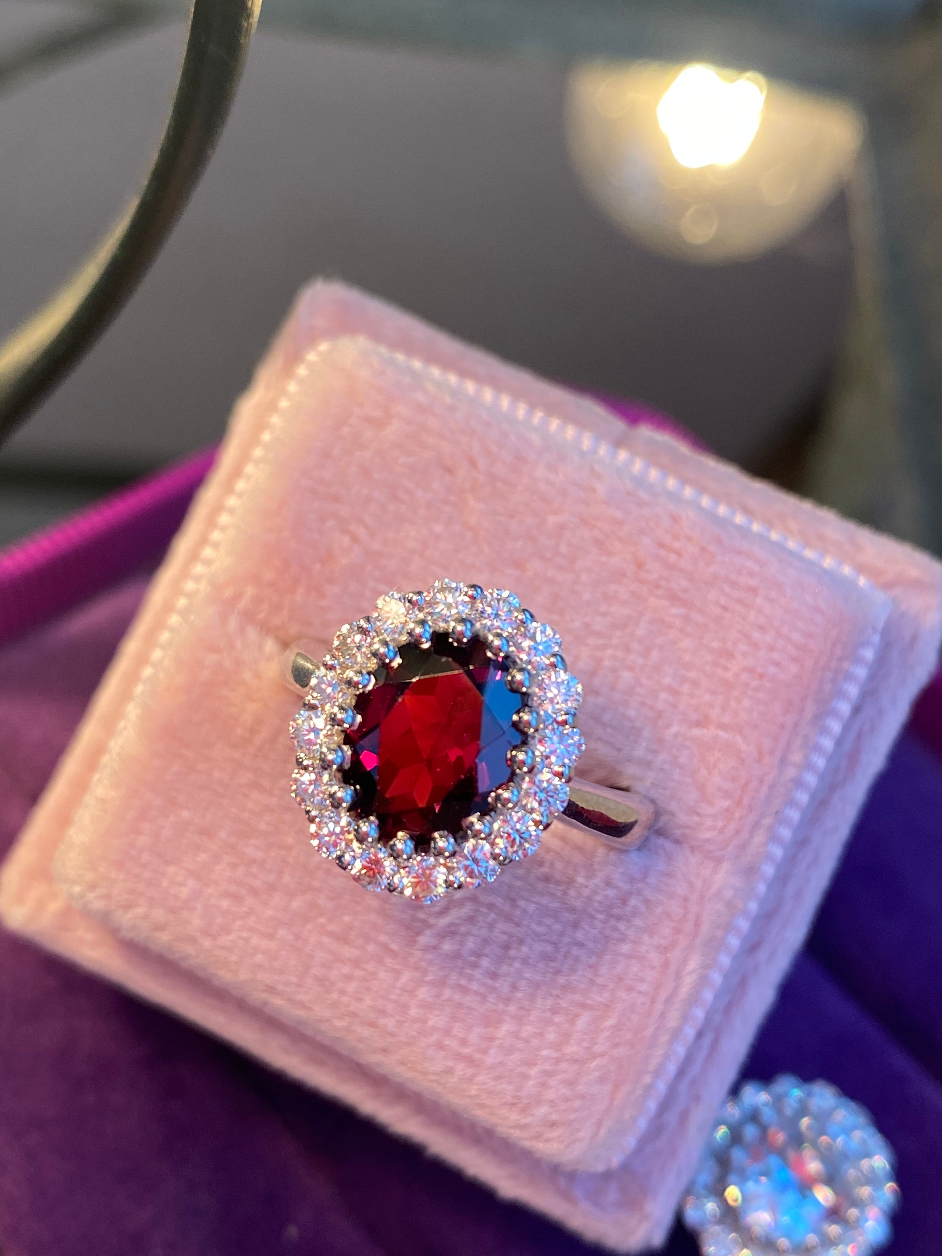 2.33 CTW Oval Cut Garnet and Moissanite Halo Ring in Sterling Silver