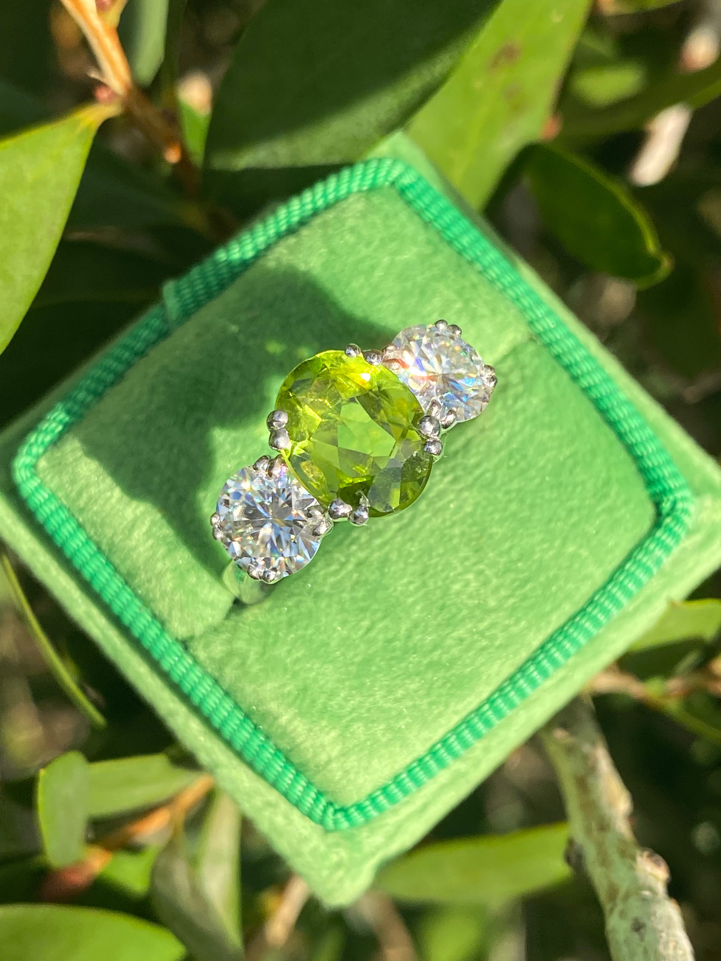 2.57 Carat Peridot and 1.84 Carat Moissanite Three Stone Ring in Sterling Silver