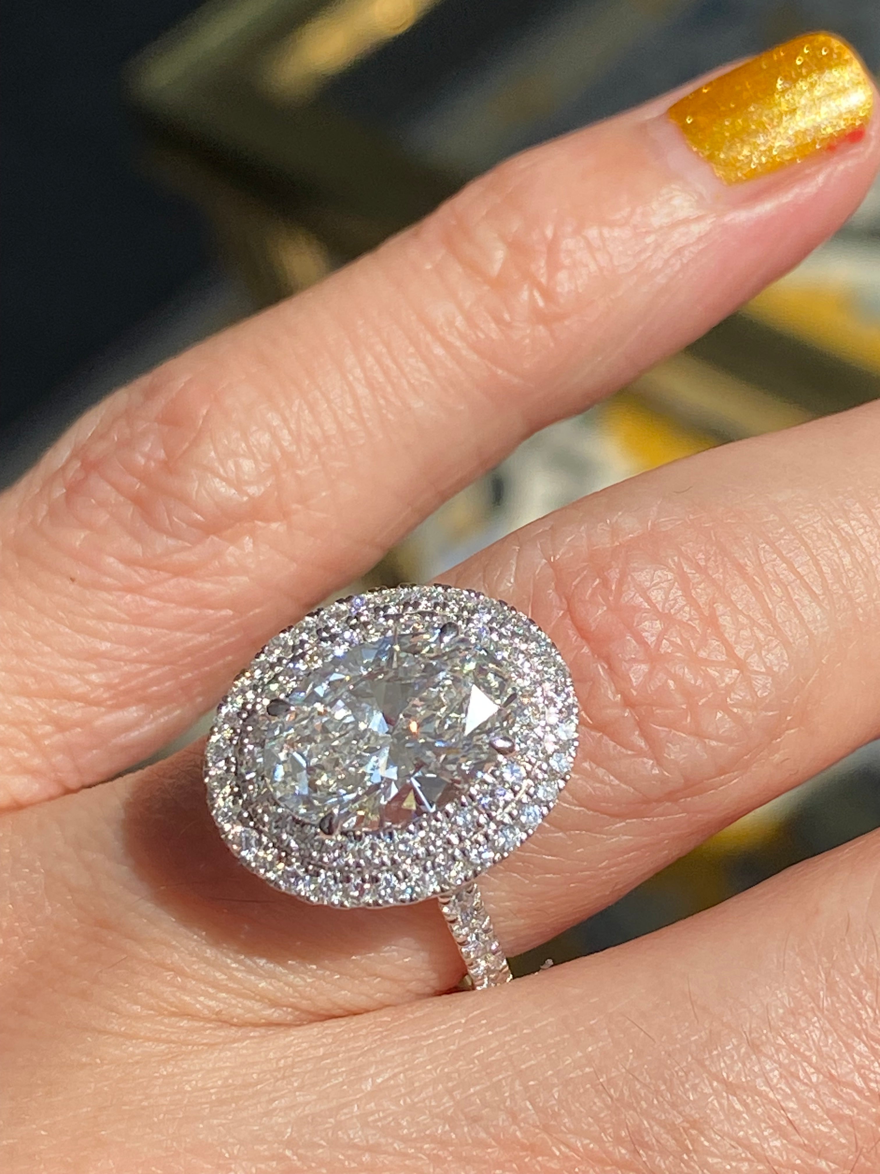 3.92 CTW Oval Cut Lab Diamond Double Halo Engagement Ring in Platinum