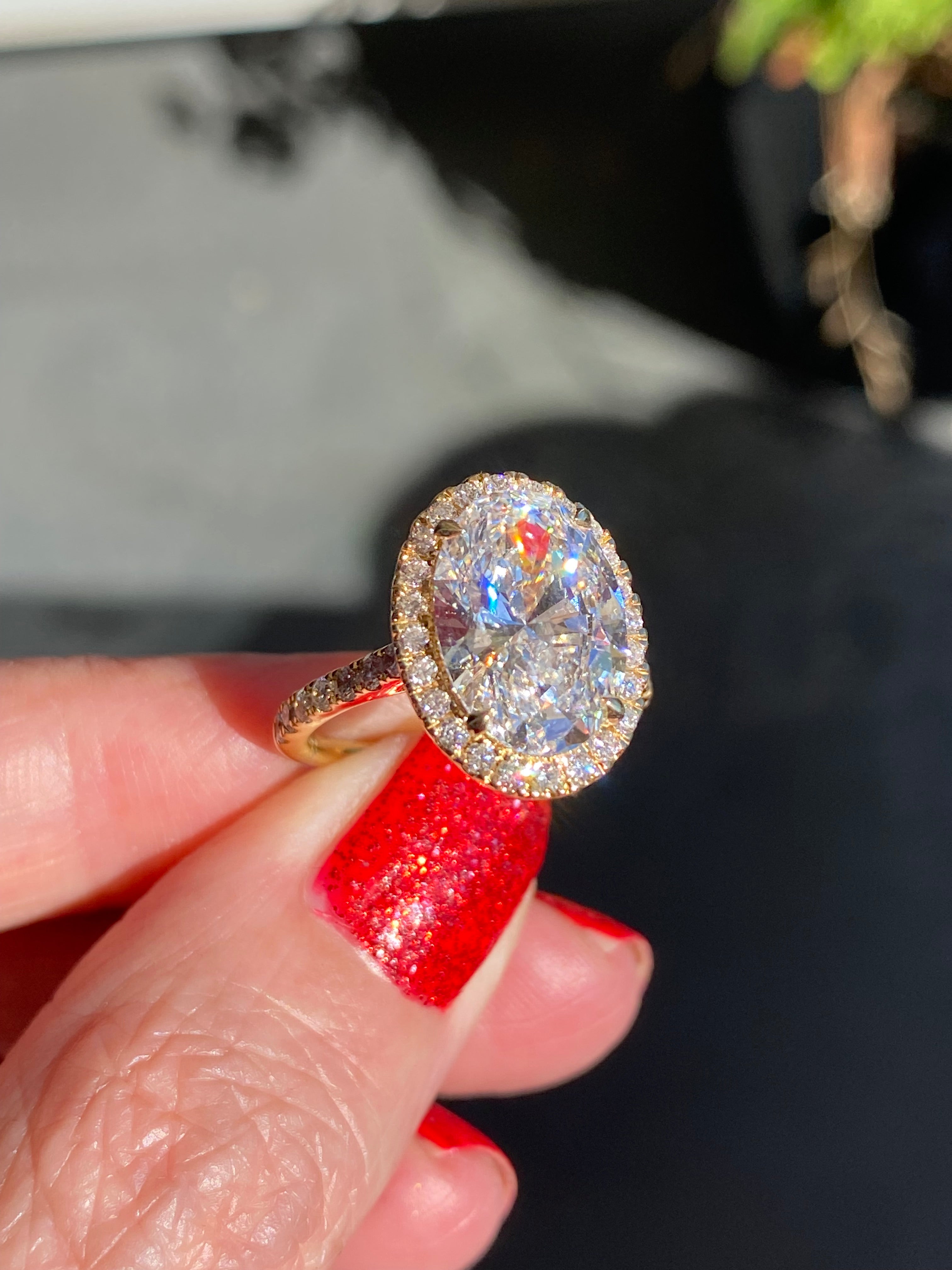 4.59 CTW Oval Cut Lab Diamond Halo Engagement Ring in 18ct Yellow Gold